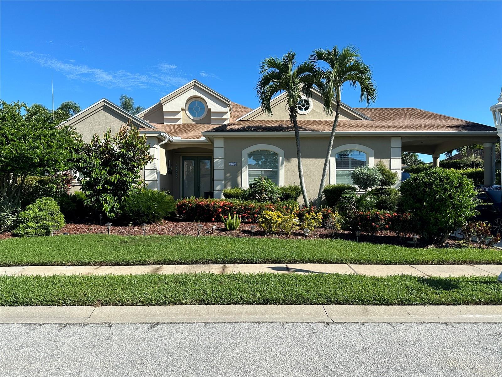 WATERFRONT LIVING!! The ideal Florida boating lifestyle is provided by this house! In the much sought-after neighborhood of THE INLETS at Riverdale, take pleasure in this stunning freshwater canal with pool and your own private BOAT dock! Walking trails, tennis facilities, pickleball, playground, kayak / canoe launch, and a community boat lift are all available in the Inlets neighborhood. The Manatee River, intercoastal waterways, and the Gulf of Mexico are all accessible from this immaculately kept boating community. This 2,213-square-foot house on a Cul-de-Sac has 3 bedrooms, 2.5 bathrooms, and a sizable flexible area that may be utilized as an office or den. Huge long driveway, carport, and two-car garage provide plenty of space for parking. The kitchen and living room are an open concept floor design. There are two dining areas: a breakfast nook space off the kitchen and an official dining room. The chef's paradise is the gourmet kitchen! This kitchen features a sizable induction cooktop with tile backsplash, built-in stainless-steel appliances, a microwave, a wide French door refrigerator with an ice maker and a separate Kitchen Aid wine refrigerator, a double oven, solid wood cabinets with numerous pull-out drawers for convenient storage, and two roomy granite-topped bar seating areas. Large laundry room off the kitchen; walk-in pantry with built-in cupboards. The kitchen, primary living areas, and bathrooms have tile flooring. The master bedroom has carpet. Spacious Master bedroom with views of the pool area and canal. The main bathroom has a big walk-in shower, a separate water closet with a second vanity behind a pocket door, and quartz counters with matching tile accents. The office and bedrooms share a hall bathroom with a glass-enclosed shower and are situated on the other side of the house for seclusion. The third bedroom is in the back of the house. There is a lovely pool deck and a screened-in area all around the pool. Let’s not forget a ½ bath off the pool area. There is plenty of room on the spacious pool deck for outdoor grilling and relaxing while admiring the views down the canal and seeing the most amazing sunsets. The concrete dock located in the back has water and electricity hookups for all your boating requirements. ***BONUS*** Owner pays for pool service and Lawn Care!! The community boat lift is located on the same canal at the end of the road. You will have the convenience to take your boat out of the water and the boat lift will accommodate a 20,000 lb. boat. Close to I-75 UTC Mall, Ellenton Outlets. Take your boat on a short drive to restaurants like Woody’s River Roo or Pier 22, Anna Maria Island. This home will not last long!!