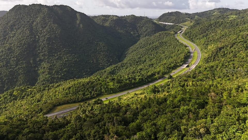 One or more photo(s) has been virtually staged. Imagine owning nearly two acres of peaceful countryside — approximately 1.9997 cuerdas (~7,859?m² / 84,600?sq?ft) — nestled in the lush mountains of Cercadillo, Cayey. With around 30 *cent of the land cleared and the remaining 70 *cent covered in serene forest, this parcel offers a unique canvas for your dream rural retreat. Enjoy breathtaking panoramic views from your own hillside sanctuary with 40 meters of road frontage and a quiet setting just off PR-715 at Km?5.7. Zoned AD?30 *cent / B-Q?70 *cent (rural general), the land supports residential and rural uses, perfect for building a custom home, tiny house, or eco-cabin. The lot is undeveloped, but nearby access to public electricity and private water/gas services makes it a flexible investment. No sanitary or storm sewer systems are present. Access is via a quaint 3-meter-wide asphalt road, and the property is outside FEMA-designated flood zones (Zone X), with no environmental issues reported. The current market value is $87,000.
Just minutes away, you’ll find some of Cayey’s most iconic natural and cultural attractions — including the Carite Forest Reserve with hiking trails and waterfalls, Charco Azul for swimming in crystal-clear mountain waters, and the famous Lechoneras of Guavate, a culinary hotspot known island-wide. Also nearby are the Plaza Pública de Cayey, Museo de Artes Populares, and easy connections to PR-1 and PR-52 for quick access to Caguas and the southern coast.
This property is offered without regard to race, color, religion, sex, handicap, familial status, or national origin.
