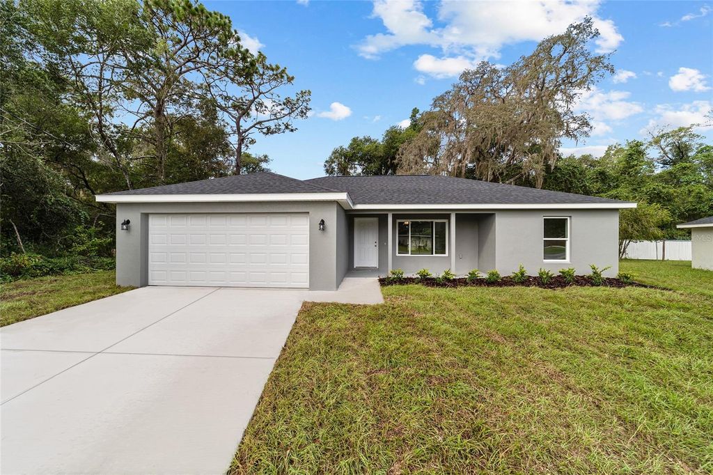 Photo of 874 NE 130th Terrace, Silver Springs, FL 34488 (MLS # O6372920)