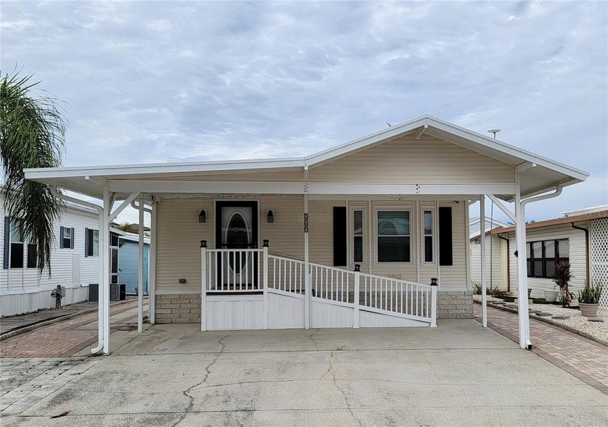 Well kept manufactured home with 1 bedroom plus large living room with a Murphy bed setup. There's a spacious dining room, and a clean kitchen with a separate breakfast nook. There are 2 bathrooms, with the 2nd one also housing the stacked washer and dryer. The master bedroom has built-in cabinetry. There's an additional storage room in the back corner of the structure, accessible from both the outside rear door as well as from the laundry bathroom. The entire property is surrounded by easy maintenance brick pavers, with ample parking. Located in the security gated Active Adult Only 55+ amenity filled community of Center Crest, this home is convenient to shopping, entertainment & medical services along the Hiway 27 / I-4 corridor. You own the land, Fee Simple. There are NO monthly lease fees, with very modest annual HOA dues.