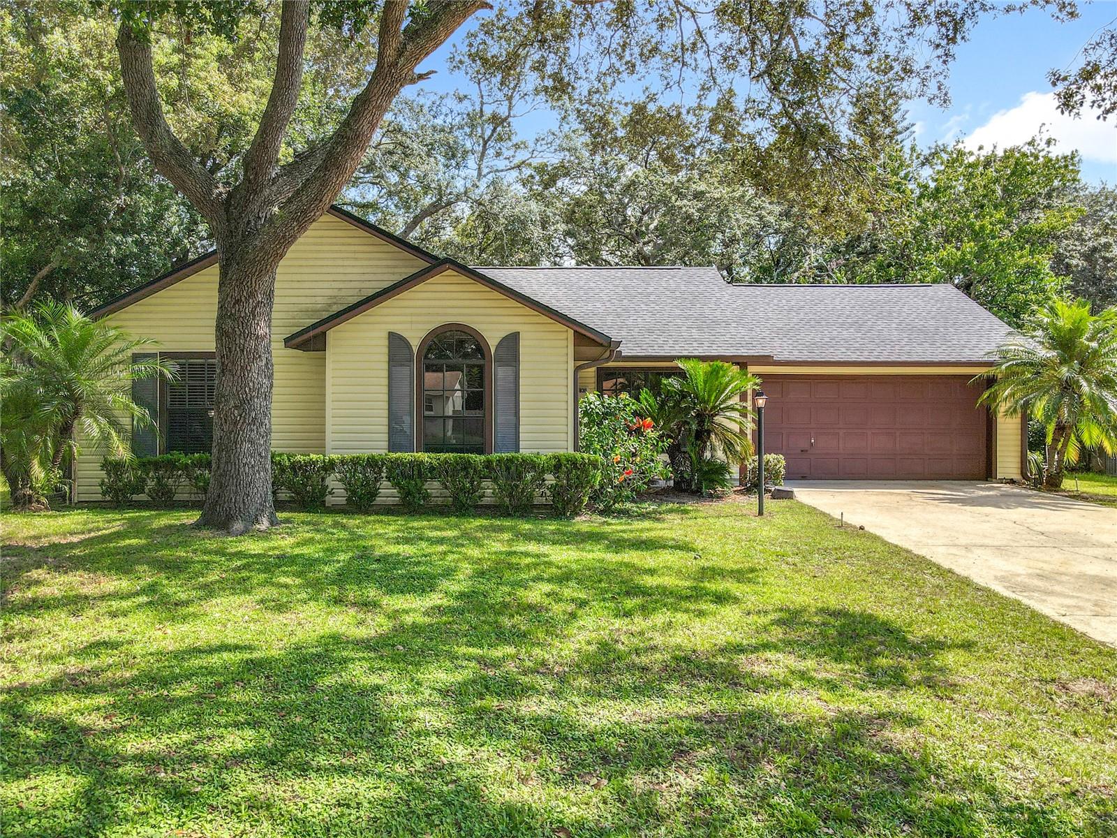 Super price for this affordable 3/2 with NO HOA, oversized fenced in lot, plus two storage sheds! NEW ROOF 2024, REFRIGERATOR-OVEN/STOVE-MICROWAVE-DISHWASHER NEW 2023, GARBAGE DISPOSAL NEW 2025. Remodeling was started inside with all new flooring throughout, painted the entire inside, all new fans and light fixtures throughout, updated kitchen cabinets, replaced faucets in the in the master bath, installed extra shelving above toilets, replaced all door handles, installed new closet storage racks, and landscaped around the home. There's also a huge Florida room under air that leads out to a large, covered patio. Spacious, private, and fenced backyard with firepit. Plenty of space for a POOL! Oversized 2-car garage, lots of storage space. Wonderful mature community in a fantastic location! Only 35 minutes to Disney theme parks, 20 minutes to downtown Orlando and all its incredible dining options, entertainment, and shopping. 40 minutes to Orlando International airport and just over an hour to East coast beaches. Come call this home yours today!