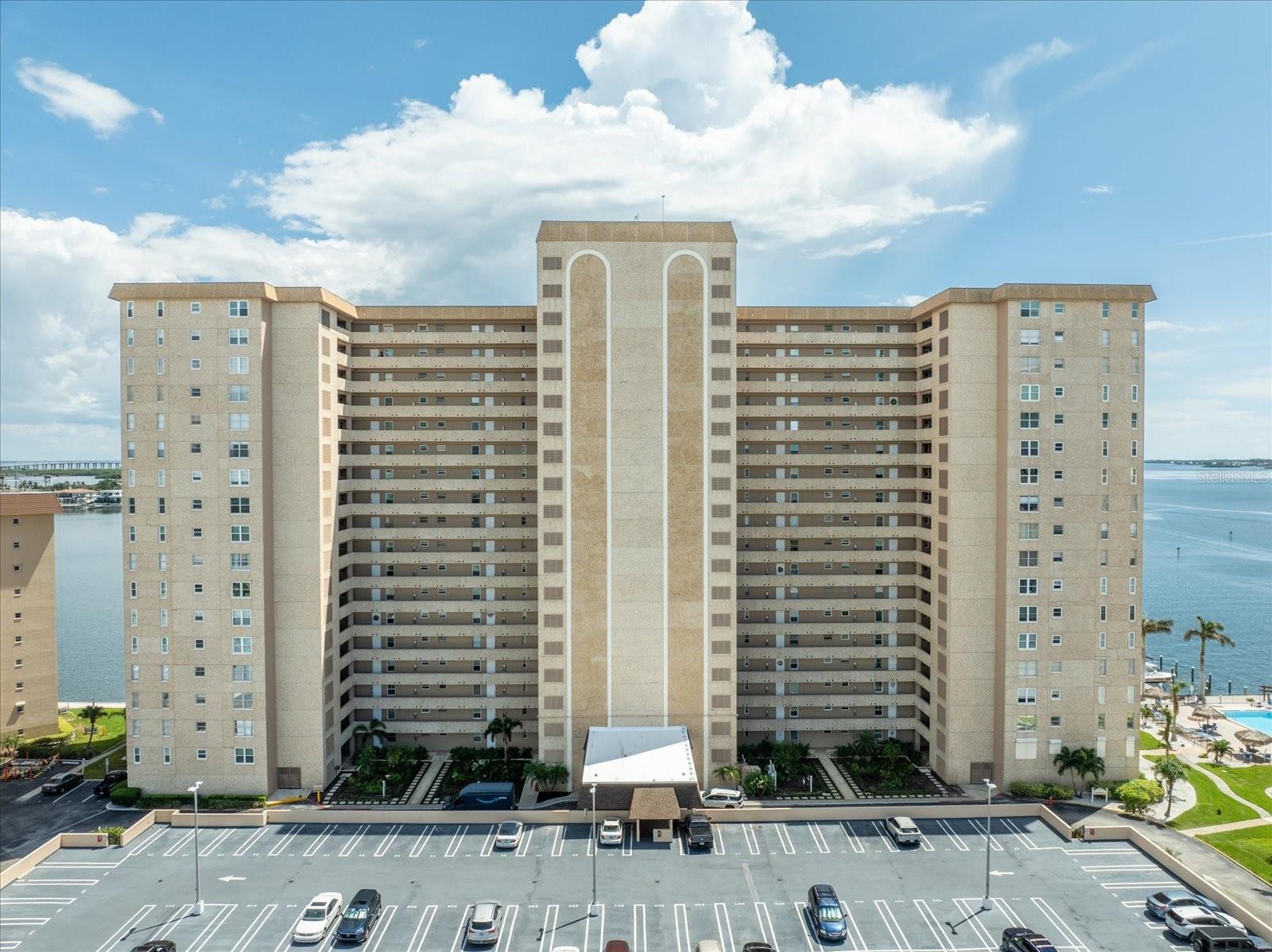 Welcome to paradise! Perfectly situated on the serene waterfront of St. Petersburg, this exquisite 2-bedroom, 2-bathroom condo offers
breathtaking southeast-facing views from the third floor, giving you a "cruise ship" experience every day. Enjoy the tranquility of natural sunlight without the glare while enjoying the beauty of our Florida water views. Key Features include new floors, new carpet, and fresh neutral paint throughout. All electrical outlets and light switches have been updated for modern convenience. State-of-the-Art Kitchen: The brand new kitchen is equipped with top-of-the-line Samsung appliances, including a dishwasher, chef's oven, microwave with assorted features including a steam roast element and air fryer, and a refrigerator equipped with ionized water and ice maker and a wine compartment. A large bar complete with new 5 burner glass cooktop, slide out storage under the bar and hidden trash can that slides out. Enjoy soft close doors and drawers, a disposal, and matching marble finishes in both the kitchen and bathrooms. Luxurious Bathrooms: Both bathrooms feature brand new elongated toilets, marble finishes, & new plumbing fixtures. Each bathroom features new tempered glass barn door sliders in both showers and tempered translucent windows. 2 years new, high impact glass windows that rotate 90 degrees so that they are easy to clean! Custom Storage Solutions: Newly installed custom closets in the primary suite, guest room, hallway, and linen closet provide ample storage space. Additionally, enjoy two very large storage units on the 3rd floor (3x3 and 8x4) conveniently located walking distance from your unit. Comfort and Convenience: New air handler, a new 2.5-ton AC unit in a protected area, Wi Fi Voice Command thermostat and new full-size washer and dryer. The vents and air conditioning ducts have been recently serviced. Four new 52 inch ceiling fans with LED light bulbs. Primary Suite Retreat: The primary suite features new French doors and custom closets, providing a luxurious escape. Guest Room/ Office: The guest room includes a built-in floor-to-ceiling desk and shelving, perfect for a home office. Additional Amenities: A desk area with a window in the kitchen, 1 covered parking garage space, and free cable and internet (a $309 value). Resort-Style Living: Enjoy access to 4 pools, a resident center with a billiards room, card room, large auditorium, library, and event schedule. Active Lifestyle: Take advantage of daily workouts in the gym, tennis courts, and a sidewalk around the island. The community also features a canoe/kayak launch and 3 docks with boat slips available. Non smoking building. Security and Convenience: A gated community with key fobs and code, on-site nighttime security, and management. Visitor parking is available for your guests. Local Amenities: A store with a deli and butcher shop on the island makes everyday shopping convenient. Additional Perks: The community is 55 plus, can be rented for a minimum of 6 months, and includes a wheelchair lift into the main pool. No assessments or HOA increases scheduled, the milestone and wind mitigation studies completed and attached. Don't miss this opportunity to live in a beautifully renovated condo with unparalleled amenities and stunning water views. Schedule your private tour today and make this waterfront oasis your new home!