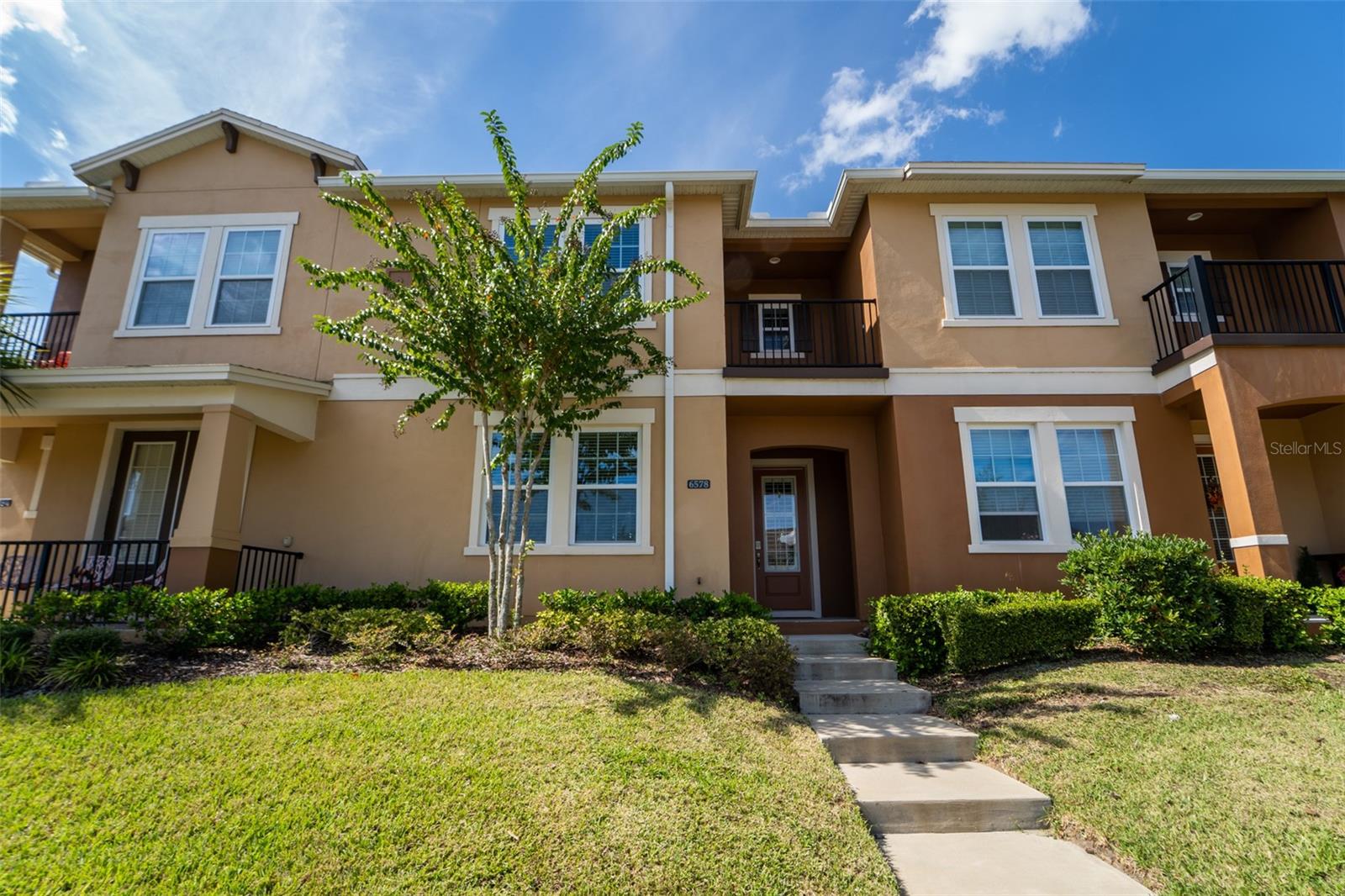 This luxury 4bd/3ba townhouse is located in the highly sought-after Hamlin Reserve at Winter Garden. Upgraded first floor laminate floor, ceiling fans in the living room and all bedrooms, digital door locks, WiFi thermostats and Cat 5 network cable to all bedrooms and living rooms are just a few of the many features of this gorgeous home. Upon the entry a stunningly stylish custom-made Barn Door slides open to a large guest bedroom with a full bathroom. A spacious and open living room connects the modern kitchen to a great court yard. The gourmet kitchen boasts thick quartz counter top, 42” cabinetry/upgraded hardware, subway tiles backspalsh, a beautiful pendent light over the huge kitchen island and a complete stainless steel appliance package. The private courtyard with extended concrete slab and artificial greens is maintenance free, and it’s a perfect place to enjoy the outdoor with family and friends. A wide walk way roof over the courtyard connects the two-car garage to the house, keeping you from the rains in the summer afternoons. On the second floor you will find a spacious primary bedroom with large windows. A glass door leads to a neat balcony for morning coffee and relaxation. You will also love the over sized walk-in closet with a window, the beautifully tiled bath, and the L-shaped double sink/vanity with a makeup counter. There are two more bedrooms sharing the third full bath down the hall. Next to the bedrooms conveniently sit the laundry room with large capacity Samsung washer/dryer.
This community includes a dog park, a beautiful swimming pool, clubhouse and sidewalks throughout. The Hamlin Reserve is in the center of Horizon West, the fastest growing master-planned community in the nation. Nestled in this thriving community, you’re just steps away from top-rated schools, trendy dining, and endless entertainment, such as Hamlin Town Center, Publix, Walmart, Cinepolis luxury theater and much more. With easy access to SR429, FL Turnpike and SR408, it is 15 min to Disney, 25 min to downtown Orlando and 30 min to airport. Don’t miss your chance to own this upgraded beauty—schedule a tour today and step into your dream home!