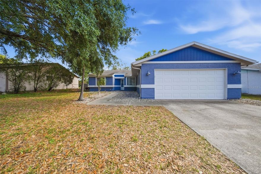 Waterfront charm meets everyday comfort in this 3-bedroom, 2-bath home tucked away in New Port Richey. Set on an oversized lot overlooking a peaceful pond, this property offers the kind of backyard setting buyers dream about, complete with a private dock perfect for morning coffee, fishing, or unwinding at sunset. Inside, the layout is functional and inviting, with comfortable living spaces and plenty of natural light. The kitchen provides ample cabinet and storage space that overlooks the spacious living room. From the living room, you can transition outside where you have a screened-in back porch overlooking the water. Outside, mature trees add character and shade, creating a private, serene feel. Conveniently located near shopping, dining, Gulf beaches, and commuter routes, you get the best of tranquility and accessibility. Affordable waterfront living with room to make it your own: don’t miss this one!