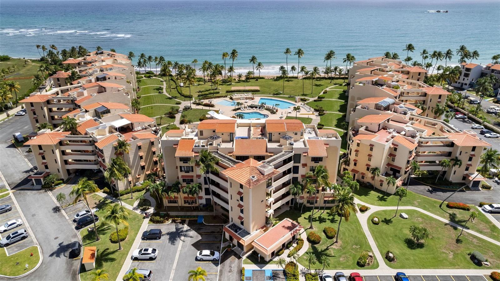 Experience prime beachfront living in this spacious 3-bedroom, 3-bath condo located in the most desirable building at Crescent Beach, Palmas del Mar—just steps from the sand and surf. This unit offers an expansive terrace that spans the length of the residence, providing panoramic ocean views and direct access to the beach atmosphere from your own home. Designed for both comfort and resilience, the condo includes Tesla Powerwall backup batteries to ensure uninterrupted power. Inside, you'll find a well-appointed layout ideal for both full-time living and vacation rental use. The building is equipped with an elevator and a full-capacity backup generator for all common areas, offering convenience and reliability. Crescent Beach is one of Palmas del Mar’s premier beachfront communities. Residents enjoy gated access, two oceanfront pools, and proximity to top amenities including the Palmas Academy, Palmas Tennis Center, Beach Club, and golf courses. This community is prized for its easy beach access, family-friendly environment, and walkability within the resort.
Whether you're looking for a serene beach retreat or a high-demand rental property, this Crescent Beach condo offers an unbeatable combination of location, amenities, and coastal lifestyle.