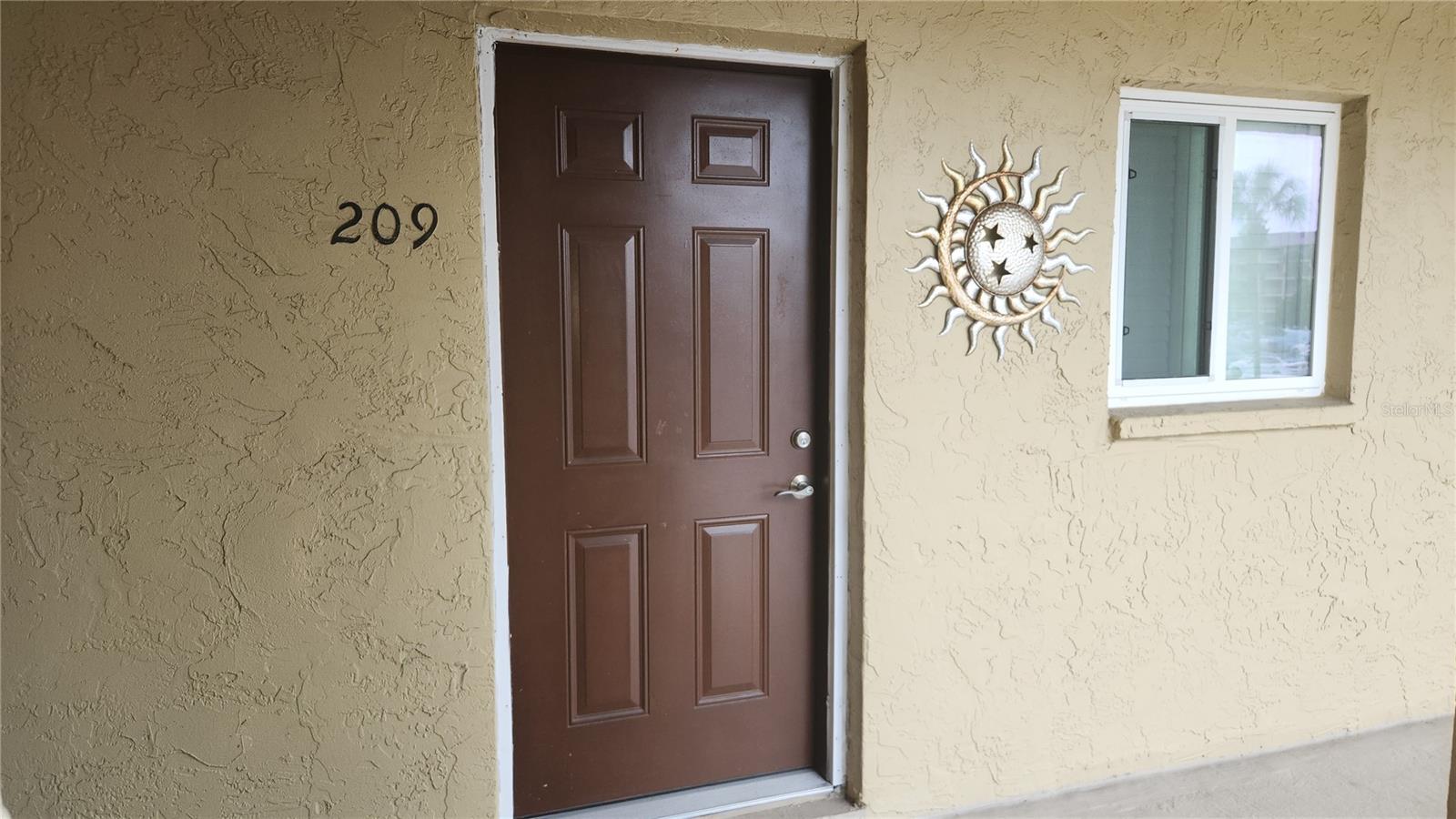 Stylishly Updated, Fully Furnished, and Just Minutes from the Beach! This 2BR/2BA END-UNIT CONDO in a VIBRANT 55+ COMMUNITY is move-in ready! Enjoy seamless laminate flooring, stylish interior doors, and a stunning kitchen with granite counters, recessed lighting, cabinets and pantry, and full LG stainless suite. Both bathrooms are refreshed with tile flooring, modern vanities, and a barn door entry to the primary en-suite with walk-in closet. The immaculate interior (updated 2022-2024) is matched by major updates: HVAC (2022), washer & dryer (2022), impact windows in the bedrooms and kitchen (2022) and water heater (2023). Relax on the fully enclosed, screened lanai—accessible from the primary bedroom and flex space—perfect for blending indoor comfort with outdoor charm. Immerse yourself in the community amenities including a lakeside heated pool & spa, fishing pier, shuffleboard, and endless clubhouse activities. All just minutes to Anna Maria Island & Gulf beaches, dining, and shopping! Home is being sold furnished with some personal items and kitchen dishes not included. Move right in and start living the Florida lifestyle you deserve!