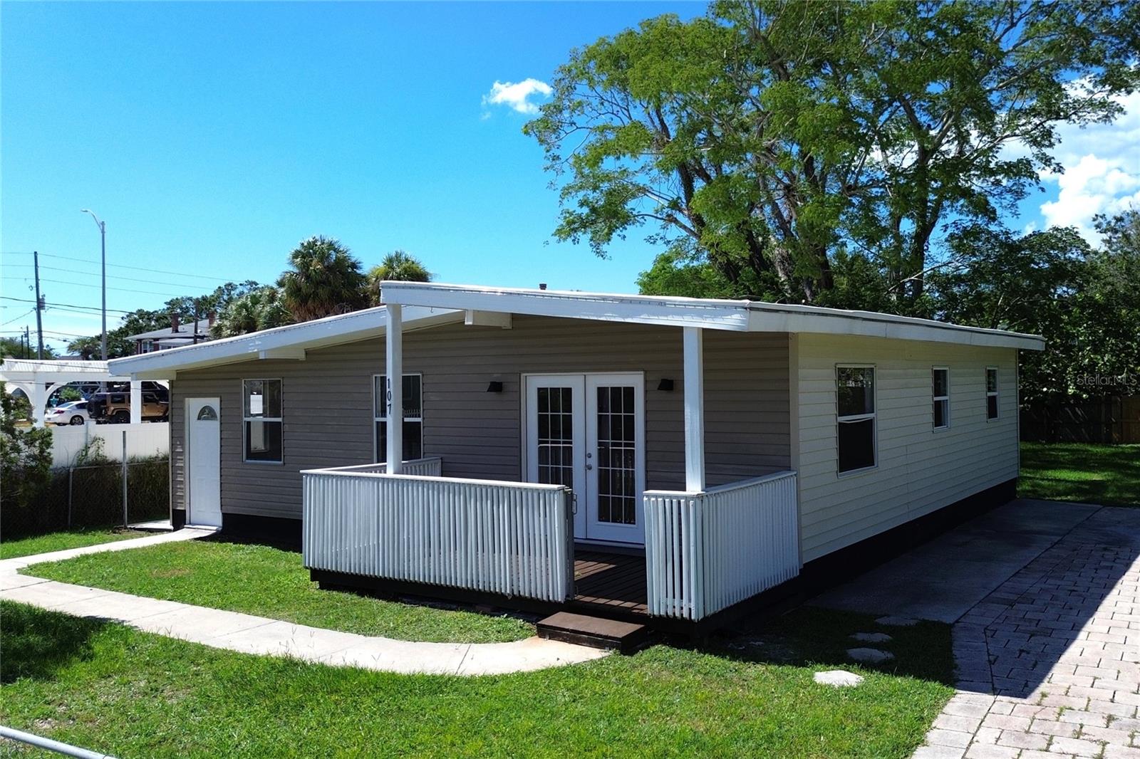 This newly renovated home offers the best location in Tarpon Springs, bordering downtown and the Pinellas Trail. It would be an excellent Airbnb property with three bedrooms, two full baths, a large fenced-in backyard shaded by a beautiful Florida elm tree, and 2025 modern finishes, including new appliances. With no HOA restrictions and mixed-use zoning, the sky is the limit for this incredible property!