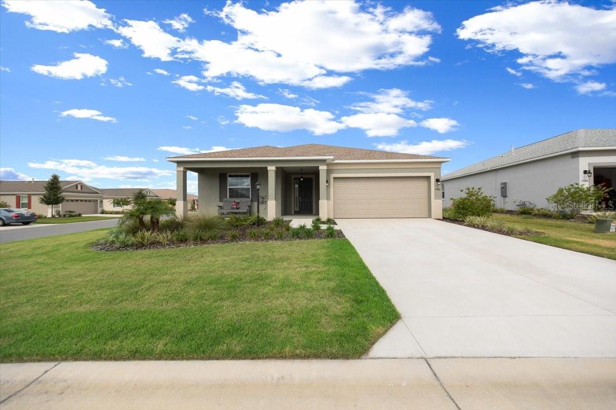 Welcome to this pristine, recently built home located in the highly sought-after 55+ active gated community of Weybourne Landing in On Top of the World. Situated on a large corner lot with a fully fenced backyard, this home offers privacy, space, and modern comfort. Featuring 2 bedrooms, 2 bathrooms, a bonus room with double glass doors, and a 2-car garage, this home is designed with both function and style in mind. Step onto the cozy front porch, then into a bright, spacious foyer with luxury vinyl plank flooring throughout. The guest bedroom and full hallway bathroom (with a tub/shower combo) are located at the front of the home. The primary suite is positioned at the rear for added privacy and includes an en-suite bath with dual sinks, a walk-in shower with bench seating, and a generous walk-in closet. The open-concept living area is perfect for entertaining, offering bar seating and a modern kitchen countertops, soft-close cabinets, and a closet pantry. The laundry room includes added storage cabinets and is plumbed for a sink. Additional upgrades include a water softener, epoxy-coated garage flooring, and built-in storage racks and cabinets in the garage. Residents of Weybourne Landing enjoy resort-style amenities, including a clubhouse, heated pool, ballroom, The Club at Candler Hills Restaurant, fitness center with classes, outdoor pavilion with BBQ area, pickleball courts, mini golf, dog park, meeting rooms, and more. Conveniently located close to shopping, dining, medical facilities, and everything you need for easy, active living.