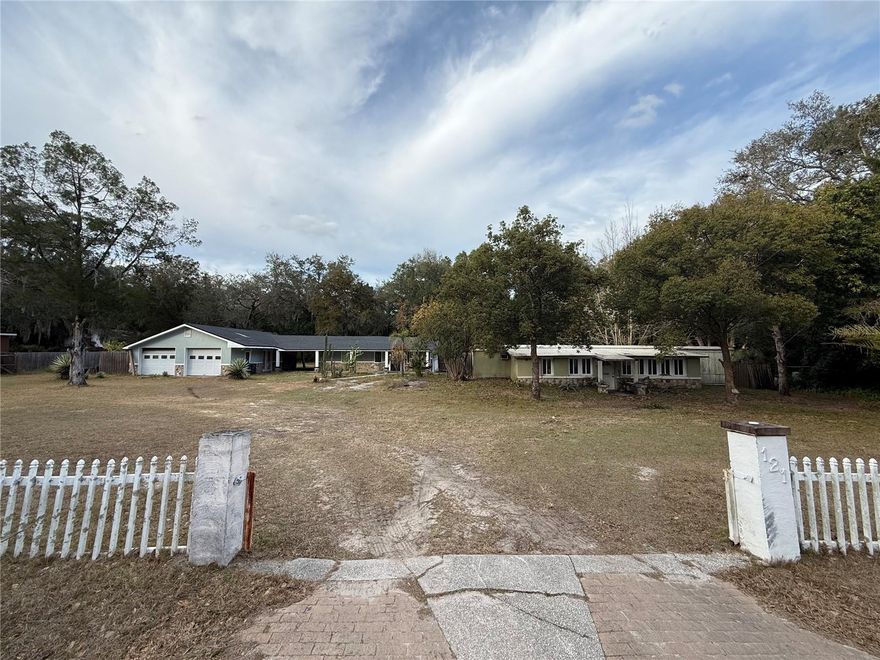 Investor opportunity on over 1 acre in Apopka! This unique property features a 2BR/1BA single-family home and a separate 2BR/2BA manufactured home, offering excellent potential for rental income or multi-generational living. The single-family home includes an updated kitchen with newer appliances and an updated primary bathroom, with minor updates needed to modernize the space. The manufactured home requires major repairs and updating but offers strong upside. A large 2-car garage/workshop with an unfinished studio is located on the property, adding additional potential. Conveniently located just minutes from Rock Springs, Wekiwa Springs, dining, and shopping. Property sold as-is.