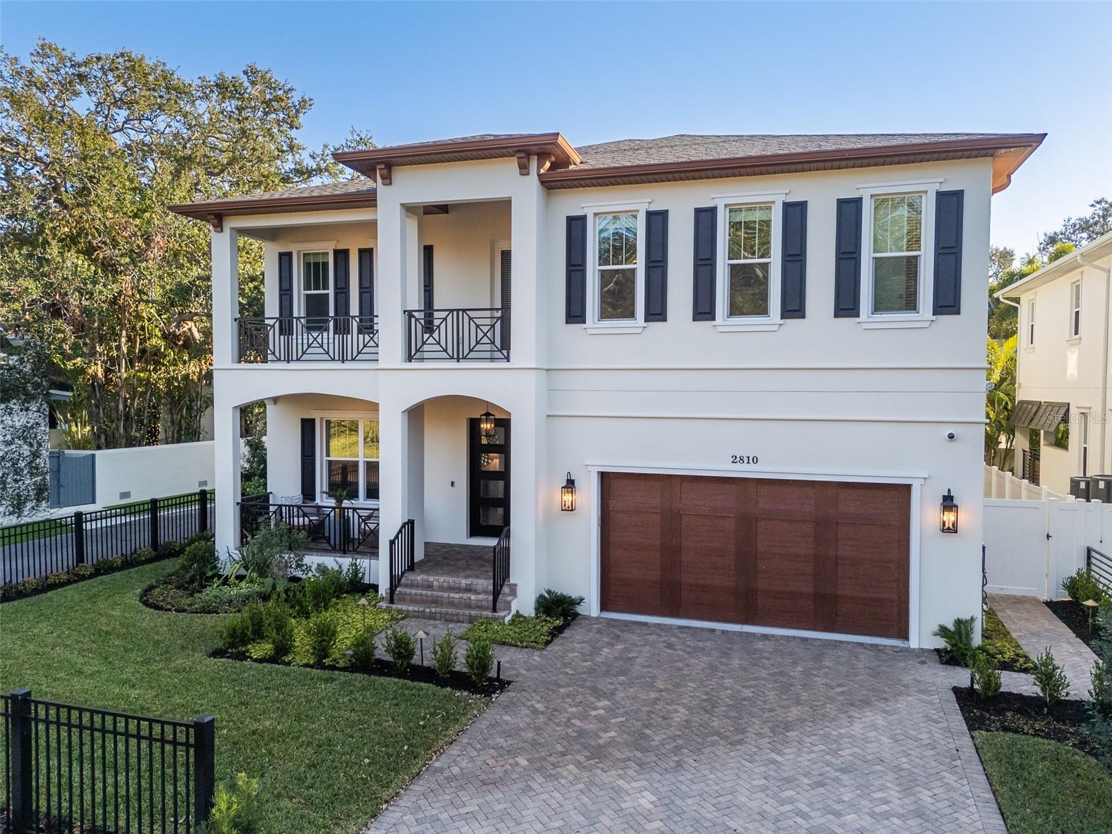 Exceptional Bayshore beautiful residence presenting an unparalleled opportunity to own just steps from iconic Bayshore Boulevard. The meticulously constructed two-story block home seamlessly blends sophisticated design with modern functionality, creating an exquisite living experience. The gourmet kitchen features a substantial center island, professional grade Thermador stainless steel appliances, including a 48-inch gas range, shaker cabinetry, elegant quartz countertops and backsplash, and chic hardware exuding contemporary style. A thoughtfully designed butler's pantry provides additional storage and preparation space and offers a wet bar and with a new wine refrigerator. A separate formal dining room with scenic views provides an elegant setting for hosting special occasions. The interior of the home is defined by refined details and premium finishes as well as the functionality of a guest suite downstairs and a bonus living room upstairs. The spacious primary suite serves as a sanctuary, boasting an expansive built-out walk-in closet and a spa-inspired primary bath. The luxurious bath features a large frameless glass walk-in shower and a freestanding deep soaking tub, creating a haven for relaxation. Outdoor living is elevated to an art form with a screened lanai offering a beautifully crafted cypress ceiling and complete with a fully equipped outdoor kitchen. A sparkling pool, accented by a cascading waterfall feature and a tanning ledge with a removable umbrella, offers a refreshing escape. Evenings are best spent gathered around the built-in stone firepit, creating a warm and inviting ambiance. The fully fenced backyard, meticulously landscaped, provides a private and serene outdoor retreat. Through the home, premium features abound, including 8-foot interior doors and crown molding throughout, European wood flooring, classic black exterior shutters complemented by wrought iron accents as well as Control4 technology and integrated speakers. Practical considerations have not been overlooked, with a brick paver driveway, front yard fence, two tankless gas water heaters, energy-efficient impact windows, new interior and exterior paint, lush landscaping, mosquito repellant system and an air-conditioned garage. A comprehensive security system also provides added peace of mind. Elevated on a charming brick street, this home was not impacted by any of the 2024 storms, according to the owner. Close to all the South Tampa lifestyle offers, with dining, shopping and nearby social amenities such as The Stovall House and Tampa Yacht & Country Club.