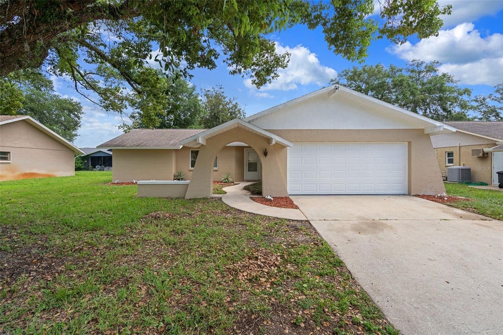 Photo of 8643 Woodbridge Dr, New Port Richey, FL 34655 (MLS # W7887402)