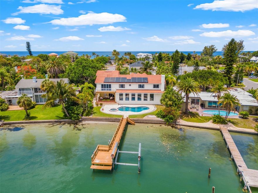 Waterfront Sophistication on Coveted Belleair Beach, one of the most Exclusive Beach Communities on Florida’s Gulf Coast. Experience all that Belleair Beach has to offer in this 5-bedroom 4.5 bath home. 75 feet of unobstructed water frontage on the Intracoastal waterway with gorgeous views of the Belleair Bridge. The residence is positioned with a raised 10 ft elevation and all of the main living spaces and one of the bedrooms on the first level, which is currently being used as an office and music room. When you arrive at the property you will notice the mature landscape and circular drive with a total of 3 garage spaces for lots of parking opportunities. Stepping up the beautiful Mexican tiled entry into the impressive two-story foyer for a grand entrance. The flexibility and configuration of the living spaces are perfect for any lifestyle and it is an entertainment dream. The Marble floors are durable and will pair well with most interior designs. The second floor offers a large primary bedroom with a balcony overlooking the pool and Intracoastal. Large ensuite bath, dual walk-in closet, built-in cabinetry, soaking tub as well as a separate shower. Two of the secondary bedrooms have an adjoining full bath, all with water views, and the final upstairs bedroom has its own ensuite full bath with shower and walk-in closet. This 1995 design was well thought out with nearly every room in the home having water views. Extra added bonuses include an in-home sauna, freshly resurfaced pool and spa, fresh interior and exterior paint, newer custom blinds, dock, Tesla Power Wall for backup power and electric car charging, central whole house vacuum, gorgeous covered lanai space to enjoy the outdoors. Community features include 4 private, residents-only parking access points to the beach.

Marina, boat ramp, fishing piers, tennis courts, pickle ball, basketball, park, and playground available for residents of Belleair Beach. Imagine watching the sunrise from your bed every morning and the sunset from the beach in the evenings. Call today for your private tour today.