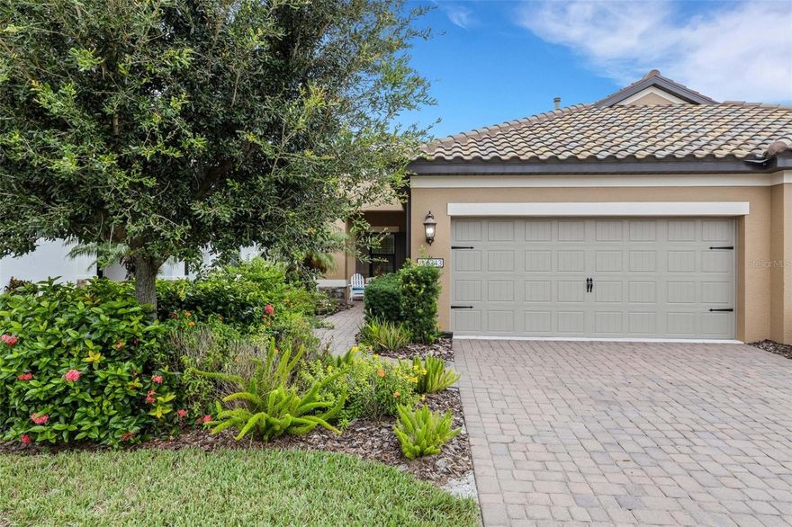 Welcome home to this pristine Villa in the highly sought after gated community of Villa Amalfi. This beautiful furnished villa features an open plan, with 2 Bedrooms and a Den! This villa is a lakefront villa with peaceful lake views. The amazing location in the heart between both Sarasota and Manatee county make this your perfect new home! The contemporary floor plan with neutral tile features a great room with a dining nook, tray ceilings as well as recessed lighting. Enjoy Florida lifestyle at its best by opening the large sliding doors to extend the living space to the extended lanai to enjoy fantastic lake views. The modern kitchen with upgraded white wood cabinetry, granite counters, under cabinet lighting, large island, and a gas range is a chef's dream. The built-in bar adjacent to the kitchen offers additional storage. The master suite features separate walk-in closets with built-in shelving as well as an ensuite bathroom with double vanities. The 2nd bedroom features a ship-lap wall! The den is ready to become the additional space you need: an office, a studio, or an exercise room/game room. All windows have plantation shutters. You will love living in this great neighborhood and meet your neighbors at the community center or the heated pool & spa, and outdoor kitchen. This villa is located in a great location, convenient to Sarasota & Bradenton, shopping, entertainment, Golfing opportunities, restaurants, markets and the beautiful Gulf beaches.