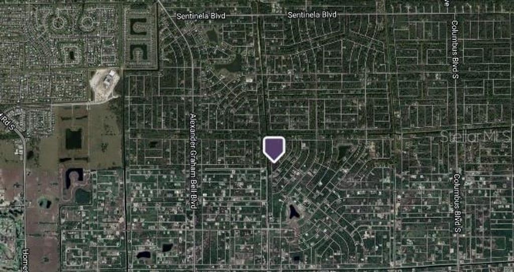 Photo of 323 Butler Avenue S, Lehigh Acres, FL 33974 (MLS # C7506289)