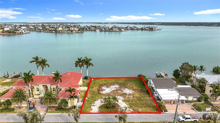 Experience the ultimate waterfront lifestyle at aptly named 12 Paradise Lane in beautiful Treasure Island! This is your opportunity to secure your own “Peace of Paradise.”  The oversized 13,500-square-foot residential lot offers 100 feet of premium waterfront, complete with a newer, overbuilt seawall. With dimensions of 100x135 feet, there is more than ample space to build your custom dream home! The prime location provides the perfect blend of serenity and convenience. Enjoy deep-water access for your boat and stunning open-water views right from your backyard! From this enviable location, you can reach the Gulf of Mexico easily in several directions! It is an ideal spot for avid boaters and beach lovers! The property is just a short 0.5-mile walk (approximately 10 minutes) from the beautiful beaches of Treasure Island. For those who enjoy city life, the vibrant community of Downtown St. Petersburg is a 15-minute drive. You are not spoiled for choice residing here! Walk out your front door OR boat from your backyard, west to enjoy the Best of the Beach and the multitude of great entertainment, dining, fishing, dancing, live music, and many more of the fun adventures that epitomize ‘The Beach Life!’ And when you feel like enjoying a more ‘cosmopolitan’ evening, travel east on Central Ave to Downtown St. Pete! There you will find a plethora of fabulous activities to explore, from the 2nd largest collection in the world of Salvador Dali paintings at the Dali Museum, or the Museum of Fine Arts on Beach Drive… Don’t forget to check out the Chihuly Glass exhibit. It is notable for being the first permanent installation in a building designed specifically for Chihuly's incredible glass art! Fancy a bite to eat? Or maybe you are up for an evening of classic libations and great entertainment? Downtown St. Pete has a plethora of options! Restaurants, bars, dancing, fine dining, fun dining, fancy and fun dining, live music, great shopping, cultural events, festivals…. The list goes on and on! You are definitely NOT nestled between a rock and a hard place… Although, you may sometimes have a hard time deciding what to do with so many great options! Life is Good. Life at the Beach is even better! Build the Beach House! Live Your Dream on Paradise Lane!  (2023 Survey available, as well as a Geotechnical Investigation from Driggers Engineering Services Dated April 30th, 2024.)