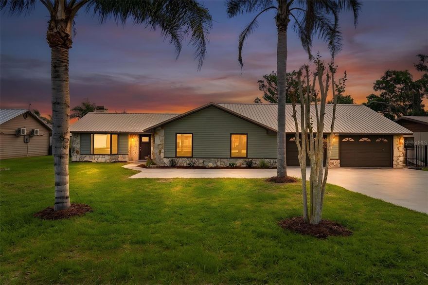 Welcome to true lakefront living on the shores of Lake Eustis, part of Central Florida’s highly sought-after Harris Chain of Lakes. This beautifully renovated 3-bedroom, 2-bath home offers direct waterfront access with your own private dock and boat lift—perfect for boating, fishing, and enjoying peaceful sunrise views right from your backyard.

Inside, the home has been thoughtfully updated to blend comfort and functionality with a relaxed lake lifestyle. One of the standout features is the indoor/outdoor kitchen, ideal for entertaining family and friends while taking in the waterfront setting. Recent upgrades include all-new appliances in both kitchens, vinyl siding, soffits, and luxury vinyl flooring. Freshly painted interior with a warm neutral tone ready for your final touches

Car enthusiasts, boaters, or anyone needing extra space will love the oversized drive-through garage, offering convenient access and ample room for storage, toys, or workshop needs—with additional space perfect for a motorcycle or golf cart. The durable metal roof was installed in 2017.

Situated directly on the Western Shore of Lake Eustis, this property combines modern improvements with the charm of lakefront living. Whether you’re looking for a full-time residence, vacation home, or investment property, this Lake Eustis gem delivers the ultimate Florida lifestyle with direct access to the entire Harris Chain of Lakes.