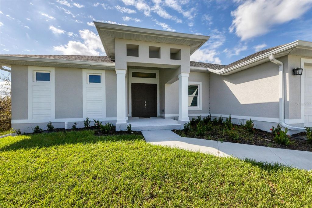 Photo of 13305 Longville Avenue, Port Charlotte, FL 33981 (MLS # C7516428)