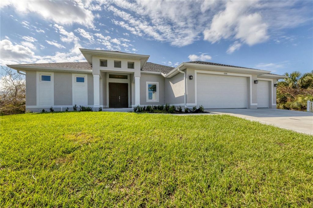 Photo of 13305 Longville Avenue, Port Charlotte, FL 33981 (MLS # C7516428)
