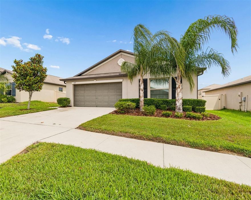 Welcome to 6307 Spring Crayfish Ave, a beautifully maintained 5 year old home powered by fully paid off solar panels and conveniently located in the heart of New Port Richey. Featuring 4 spacious bedrooms and 2 full bathrooms, this thoughtfully designed home blends comfort, functionality, and effortless hosting with ease. A desirable split bedroom layout provides added privacy, while the open concept living and dining areas are enhanced by recently installed LVP flooring and an abundance of natural light that fills the entire home, including the bedrooms, creating a bright and inviting atmosphere throughout. Step outside and discover one of the property’s standout features, an extended patio complete with a built in fireplace, creating the perfect setting for cozy evenings, gathering with guests, outdoor dining, or simply embracing the Florida lifestyle year round. The oversized backyard offers endless possibilities with plenty of room to add a pool, garden, play area, or create your own private outdoor retreat. Conveniently located near shopping, dining, parks, schools, major roadways, Downtown New Port Richey, Trinity, and just a short drive to the beautiful Gulf Coast beaches, 6307 Spring Crayfish Ave delivers the ideal blend of comfort, style, and convenience. Schedule your private tour today and experience everything this beautifully maintained home has to offer.