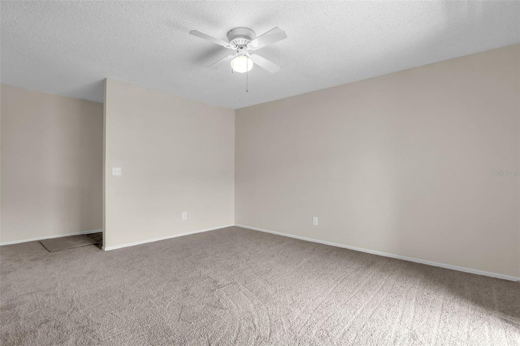 Photo of 4160 Pershing Pointe Place #4, Orlando, FL 32822 (MLS # O6436126)