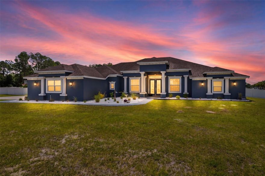 Welcome to the gated estate section of Silver Meadows North, where larger homes and spacious lots set the tone. Situated on a nearly 1.5-acre corner lot, this custom-built 2016 home offers the perfect blend of space, function, and modern updates.

Inside, you’ll find a bright open-concept layout featuring brand-new luxury vinyl plank flooring, fresh interior paint, and updated trim and baseboards throughout. The home flows effortlessly from the lead glass double door entry into a spacious great room with oversized sliding doors that open to an extended enclosed lanai—perfect for indoor/outdoor living.

The kitchen is built for both everyday living and entertaining, complete with a gas range, large island with seating, and seamless connection to multiple living and dining spaces. A flexible layout includes a formal dining room, open office area, and split-bedroom design with ensuite guest rooms for added privacy.

The primary suite is a true retreat, featuring a large bedroom, dual bathrooms, walk-in closet, and direct access to the outdoor living area.

Step outside to your private backyard oasis featuring a screened-in pool and enclosure (2021), white vinyl privacy fencing, and plenty of room to relax or entertain.

Additional highlights include:
• Roof (2016)
• HVAC (2021)
• Water Heater (2016)
• Well Pump (2024)
• Irrigation (2022)
• Septic pumped (Oct 2025)
Designed with accessibility in mind, the home features wide doorways and accessible transitions throughout.
This is the kind of property that checks boxes you didn’t even know you had—space, upgrades, privacy, and a move-in-ready feel.