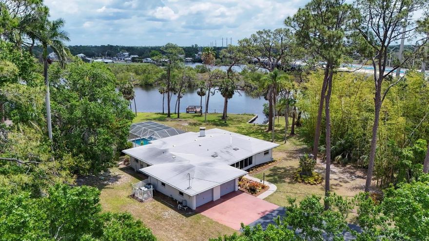 $74,000 price reduction and Investor Alert! Rare Riverfront Opportunity! Waterfront retreat located directly on the Braden River with Tampa Bay boating access!  This single family home, located just north of all the convenient dining and shopping options of State Road 70, takes you back in time to the very best in old Florida living. As you drive into the nearly 1.5 acre estate, a newly paved drive greets you as you enter the parcel with a PVC picket fence and mature trees. Here is a rare opportunity to build a brand new luxury estate on the Braden River.  With a tucked away feeling, a spacious lot, gorgeous river and mangrove views, this property also has a multi-family zoned use with a 24x24 solid block storage building with an adorably furnished mother-in-law apartment with new luxury vinyl flooring above to use for visitors or produce income, with a great view of the river.  The main home is 1810 square feet under air.  A newer Trex deck is directly on the Braden River. The south portion of the land borders a Manatee County easement for even more privacy with no neighbor. This property is being offered BELOW the April 2025 appraisal. Plenty of RV and boat parking in addition to the two car attached garage. Minutes to I-75, and an easy 30 minute drive to the gorgeous powder sand beaches of the Gulf of Mexico.  So much already in place and so much future potential if desired, a perfect investment with many options!