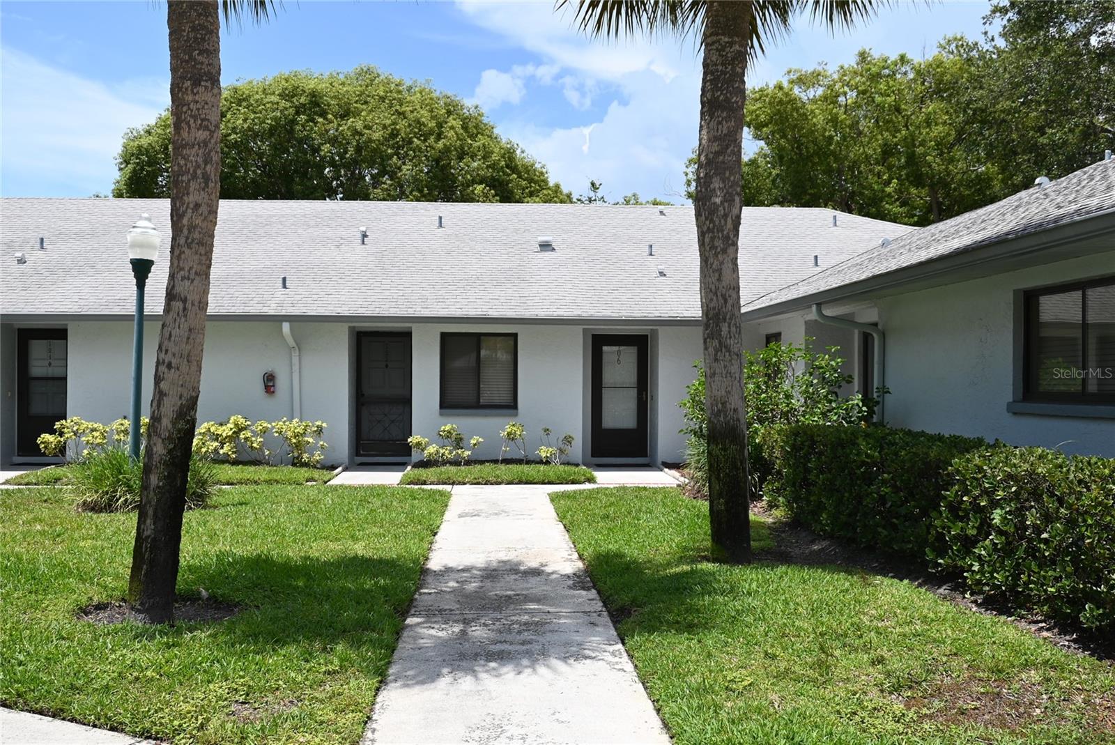 Ground floor 2/2 conrer unit villa at Bryn Mawr in Countryside. Spacious Florida room in back with separate AC overlooks a nice green area. This is an updated unit wiht laminate flooring throughout and primary bath has a walk in spa tub. Full sized laundry right off the kitchen. One assigned carport space with additonal guest parking nearby. This community has a pool and is located clsoe to just about everything. The Countryside mall is just minutes away. Water, sewer, trash, cable and internet are all included in the rent amount. One cat allowed per community rules.