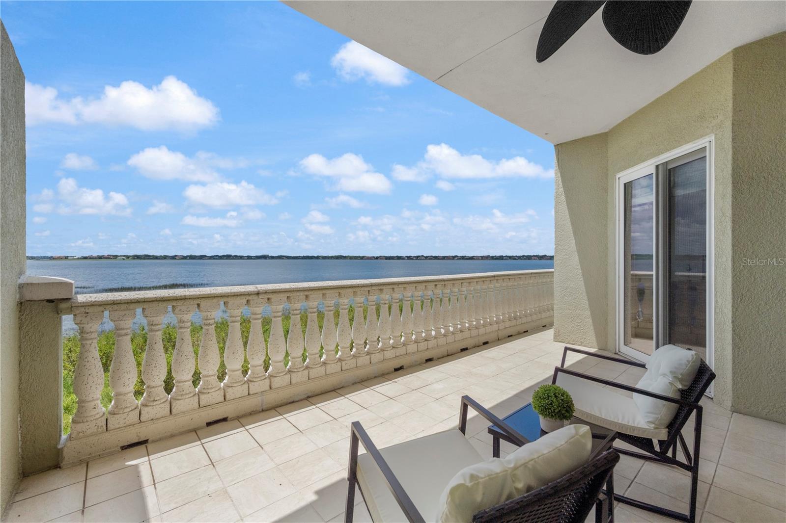 Luxury, maintenance free living in VIZCAYA! Orlando’s premier waterfront community, where world-famous attractions and the dazzling culinary delights of "Restaurant Row" are just moments away! This is not just a home; it’s a lifestyle that doesn't disappoint—one that combines resort-style living with the unmatched convenience of Dr. Phillips. Gated, Secure, and Beyond Beautiful—this guard-gated community offers 24-hour security, giving you peace of mind while you indulge in the Florida lifestyle you’ve always dreamed of. Enjoy top-tier amenities including playgrounds, two pristine tennis courts, two sparkling pools, a clubhouse perfect for entertaining, and a fully-equipped fitness center in the master clubhouse. This Home is a Showstopper! No more 2004 here! With over $200K in renovations in 2023, every inch of this home has been transformed into a modern masterpiece from floor to ceiling, with only the finest finishes! Boasting 2,162 sqft, this 2-bedroom, 2-bathroom home has additional Office space with unique, custom bookshelf doors. The open-concept design flows seamlessly with beautiful wood floors, custom plantation shutters, crown molding, 10' ceilings, and sleek 6-inch baseboards that add sophistication at every turn. New AC and ductwork, Hot Water Heater, new lowE double pane sliding glass doors, new electrical and lighting throughout...the list goes on! The chef-inspired Kitchen features high-end GE Café appliances—perfect for cooking up gourmet meals. The Primary suite is a true retreat with amazing Lake views, and complete with a spa-like en-suite bathroom featuring a custom built-in closet and a rain shower that will transport you to your own private oasis. A stylish Bedroom 2 is perfectly paired with a gorgeous high-end design full bathroom with floor to ceiling tile. Step out onto your private balcony, where the expansive views of Big Sand Lake will take your breath away! Whether you're sipping your morning coffee or winding down after a day of adventure, this serene setting is the perfect place to relax and unwind. Get ready for ultimate convenience with plenty of storage in the hallway closet plus an extra 7'x7' private storage room in the garage—perfect for all your gear, tools, and more. And another great feature...you’ll have your own reserved parking spot in the secure, under-building garage. Top it all off with fantastic schools! This home offers the ultimate combination of luxury, location, and lifestyle. If you’re looking for a place where every detail has been carefully curated and every day feels like a vacation, this is the home for you!