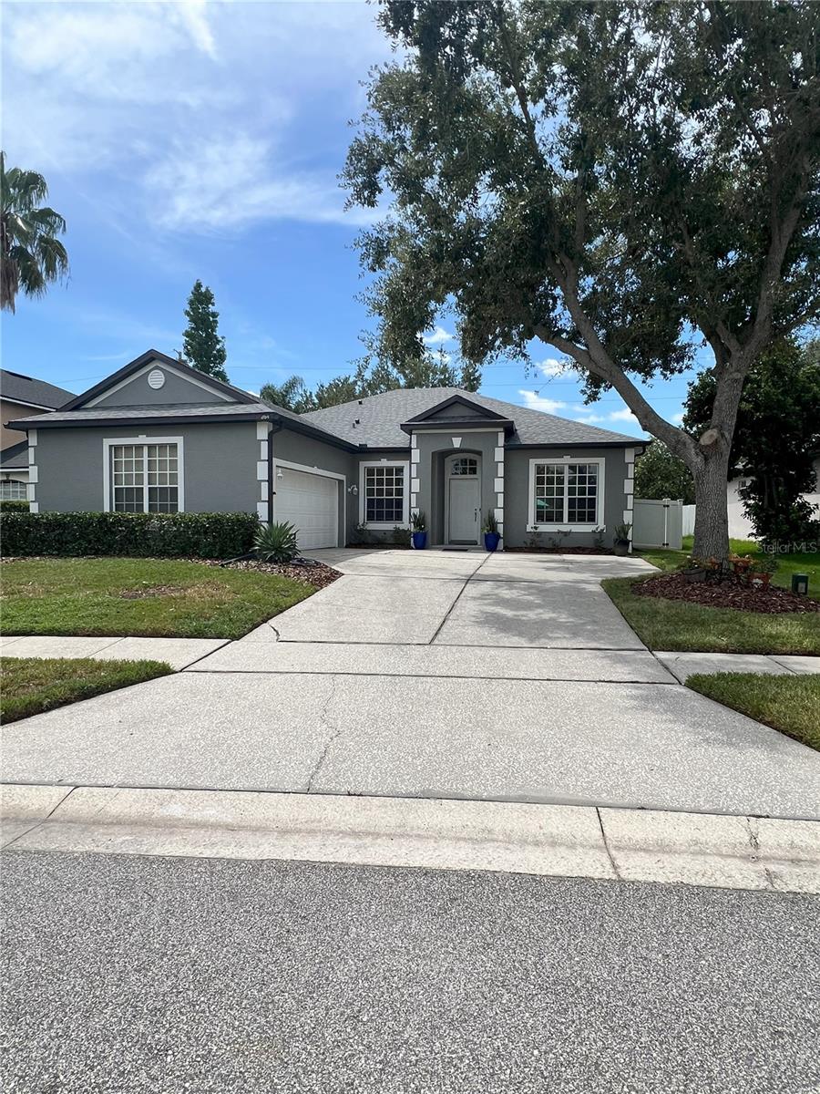 This exceptional Fenwick Cove residence offers approximately 2,530 gross square feet of space, including three bedrooms, a two-car attached garage, and a spacious driveway that can accommodate an additional four to six vehicles. Located in a gated community near the Westbrook neighborhood and Starlake communities, this home is surrounded by mature trees and beautiful gardens and falls within the West Orange High School district. Inside, the home features a formal dining room, a formal living room, and a den or family room. The recently renovated kitchen boasts dark cabinets, stainless steel appliances, and a breakfast area. The master suite includes a full master bath with a sunken tub, and the home has tile and laminate flooring throughout, with no carpet. Outdoor amenities include a kidney-shaped pool and spa with a fenced enclosure, and the home also features an updated roof and air conditioning system. The location provides excellent connectivity, being close to Florida 429, County Road 535 (Clark Road), and West Colonial Drive.
