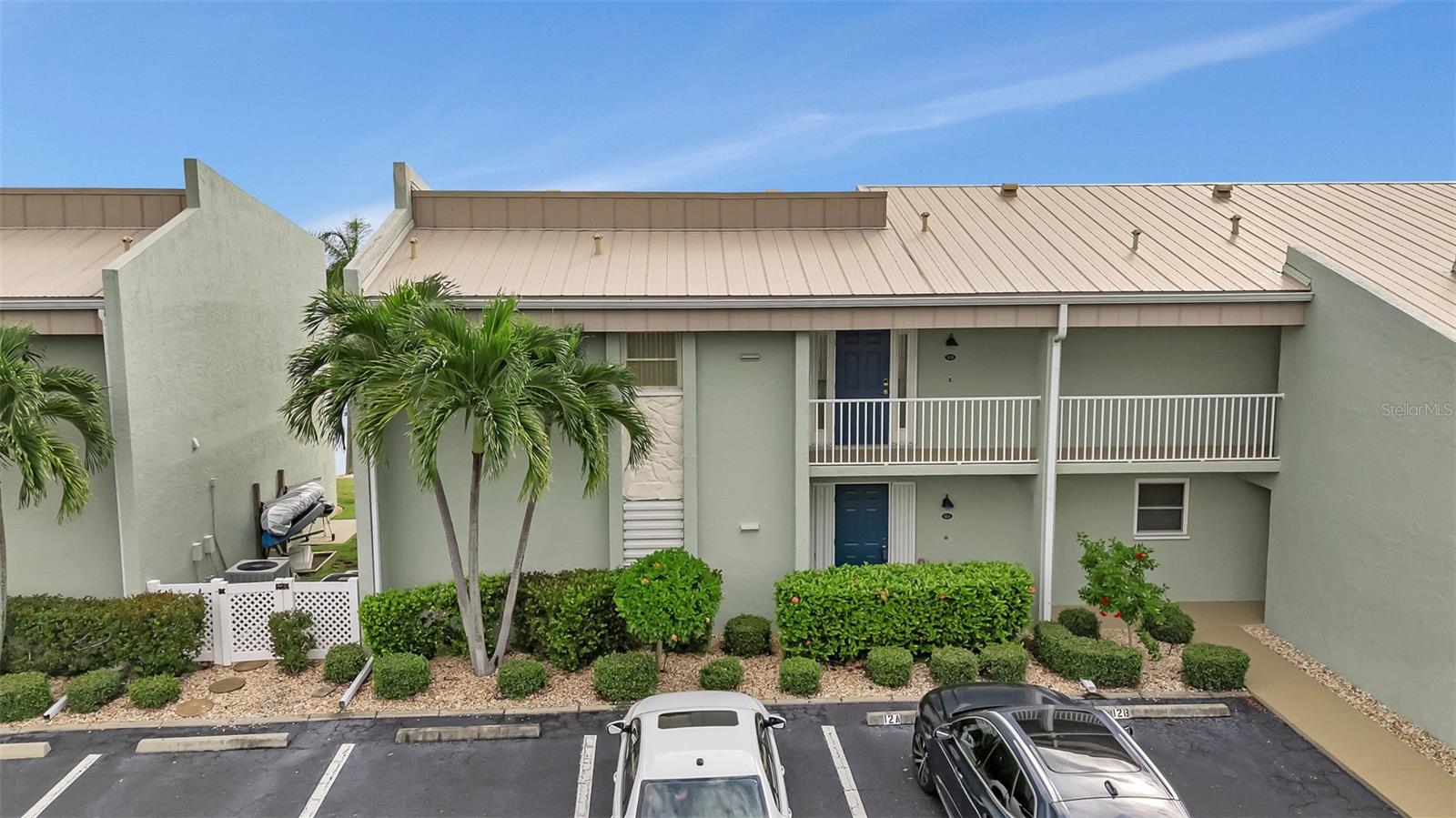 ITS ALL ABOUT BOATING! Move in ready and available NOW!!! Where are you going to find a waterfront condo with a dock and lift under $300K? !! RIGHT HERE !! And it is on a canal intersection offering beautiful water views! Charming First Floor TURNKEY-FURNISHED Waterfront Condo in Golden Sands, Punta Gorda Isles Welcome to this lovely, meticuously maintained, first-floor condo located in the highly sought-after Golden Sands community, Punta Gorda Isles. No flooding in last years storms. This move-in ready gem is offered turnkey furnished, making it perfect for those seeking a hassle-free lifestyle by the water. Located on a quiet cul de sac street filled with million dollar homes! Step inside to discover a light and bright open floor plan featuring two spacious bedrooms and two full bathrooms. The living area is enhanced with luxury vinyl plank flooring, offering a modern and durable finish. Sliding glass doors from the living room lead out to a generous 25x8 screened lanai, where you can enjoy tranquil intersecting canal views. The well-appointed kitchen features wood cabinets, Corian countertops, breakfast bar, and sleek stainless steel appliances. An adjacent inside laundry room adds convenience with a washer, dryer, and ample cabinets and shelving for storage. The master bedroom is a private retreat with direct lanai access, dual double closets, and an en-suite bathroom complete with a large walk-in shower. The guest bedroom is equally inviting, featuring two double closets, and the guest bathroom offers a tub/shower combo for added comfort. Outdoor living is a highlight of this condo. The NE facing screened lanai provides a serene spot for relaxation, with a back door leading directly to your deeded concrete boat dock (marked 12A). Boaters will appreciate the included #10,000 boat lift with ne wiring, new motors, and new controls, offering power boat access to Charlotte Harbor and the Gulf of Mexico. The community also features a heated pool for your enjoyment, and a concrete seawall maintained by the city ensures peace of mind. Additional features include a NEW metal roof (installed in 2022), hurricane shutters, crown molding, NEW lanai furniture, carpeted bedrooms, and tile flooring in the bathrooms, kitchen, and lanai. The unit also includes a grill on a concrete pad, ideal for outdoor cooking. Pet lovers will be pleased to know that this condo allows two pets up to 20 lbs each. The condo association is known for its strong financials, adding an extra layer of security to your investment. Conveniently located just minutes from golf courses, Fishermen's Village, and historic downtown Punta Gorda, you'll have easy access to shopping, dining, medical care, waterfront parks, boat ramps, fishing piers, a dog park, art galleries, and more. Enjoy walking and biking paths, weekend farmers markets, and a vibrant community atmosphere. Don’t miss the chance to own this beautiful waterfront condo in Golden Sands—schedule your viewing today!