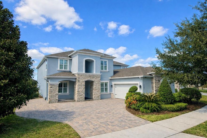 One or more photo(s) has been virtually staged. Welcome to 5365 Bowman Drive, an extensively updated and thoughtfully curated residence in one of Winter Garden’s most desirable communities. Blending architectural presence, meaningful recent upgrades, and unforgettable lifestyle features, this home offers a rare opportunity to own something truly special.
A dramatic two-story foyer sets the tone upon entry, opening to an equally stunning two-story living room filled with natural light and architectural volume. The expansive layout creates an immediate sense of openness while maintaining warmth and livability throughout.

In preparation for listing, the home has undergone substantial enhancements designed for both comfort and long-term peace of mind. Two brand-new HVAC systems ensure efficient climate control year-round. The exterior has been meticulously refreshed with professional stucco refinishing and a full repaint, delivering crisp curb appeal and a refined aesthetic. The driveway has been extended to comfortably accommodate an additional full-size vehicle with added maneuvering space — a rare and practical upgrade. Inside, fresh interior paint and brand-new carpet throughout create a clean, cohesive, move-in-ready presentation.

The kitchen is well-appointed for both everyday living and entertaining, featuring a gas range that will delight culinary enthusiasts. An intelligently designed floor plan includes an isolated guest suite with its own full bath, offering privacy and flexibility for visitors or multigenerational living.

Entertainment and leisure take center stage in this home. A custom Star Wars-themed theatre room creates a truly immersive cinematic experience — a one-of-a-kind feature that transforms movie nights into events. Step outside to your private outdoor retreat, where a heated saltwater pool and screened-in lanai invite year-round enjoyment. The backyard backs to a peaceful retention pond, offering added privacy and tranquil views.

The oversized garage provides generous storage and flexibility for vehicles, hobbies, or recreational equipment. And as a uniquely Central Florida bonus, rocket launches from Cape Canaveral can be viewed right from your own front doorstep — an awe-inspiring experience that never gets old.

Ideally located just minutes from Winter Garden Village, Historic Downtown Winter Garden, the West Orange Trail, and world-renowned theme parks including Walt Disney World, this home offers exceptional convenience while maintaining the charm and tranquility of a well-established neighborhood.

5365 Bowman Drive is more than a residence — it is a lifestyle property that seamlessly combines thoughtful upgrades, architectural elegance, resort-style amenities, and an extraordinary location. An exceptional offering in the heart of Winter Garden.