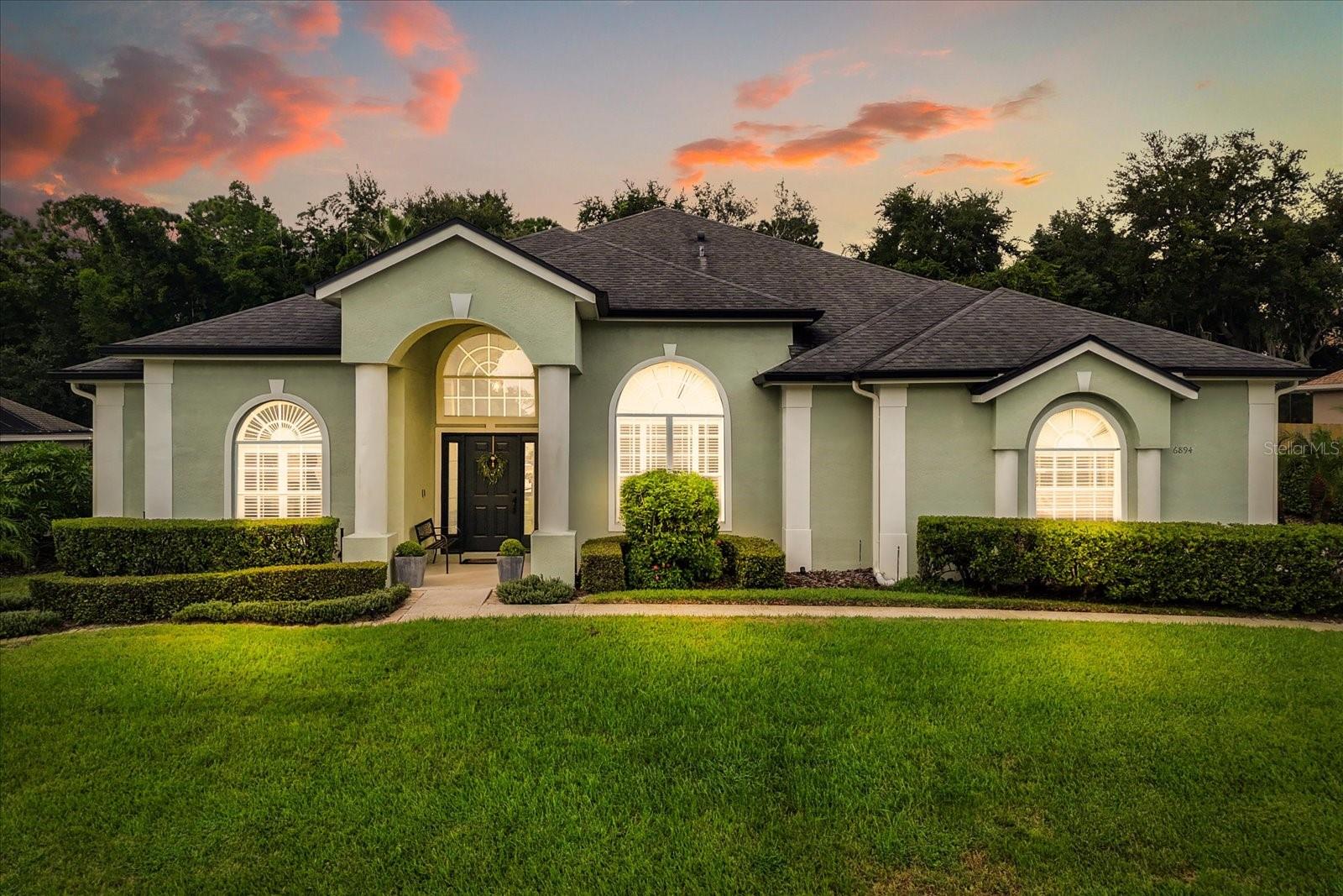 One or more photo(s) has been virtually staged. Welcome to 6894 Hidden Glade Place in Sanford, Florida — a beautifully maintained, single-story pool home that blends privacy, space, and thoughtful upgrades in a truly peaceful setting. Backing to a protected nature preserve, this home delivers true outdoor tranquility with no rear neighbors, a fully fenced yard, a screened-in lanai, and a sparkling saltwater pool that creates your own private oasis. Exterior enhancements, including fresh paint and a new irrigation system, add effortless curb appeal, while the three-car garage provides generous room for vehicles, storage, or hobbies.
Inside, you’ll enjoy 2,737 sq ft of well-designed living space featuring 5 spacious bedrooms and 3 full bathrooms. The main living areas are finished with ceramic tile flooring, while the primary and second bedrooms include brand new carpet. The kitchen is both stylish and functional, featuring modern finishes, ample cabinet space, and an open layout ideal for entertaining or everyday living. The formal dining room stands out with an elegant tray ceiling, adding a touch of architectural charm.
The updated bathrooms feature tasteful finishes and practical layouts, while the primary suite offers relaxing backyard views and a retreat-like feel. Natural light flows throughout the home, highlighting its open layout and warm, inviting atmosphere. Key systems have been well maintained for peace of mind.
Located just 6.9 miles (approx. 10–15 minutes) from Historic Downtown Sanford, you’ll have quick access to shops, dining, and waterfront events. Wilson Elementary School, an A-rated public school, is approximately 1.8 miles away.
This move-in-ready home offers timeless features, modern comfort, and a one-of-a-kind backyard setting in one of Sanford’s most desirable areas.