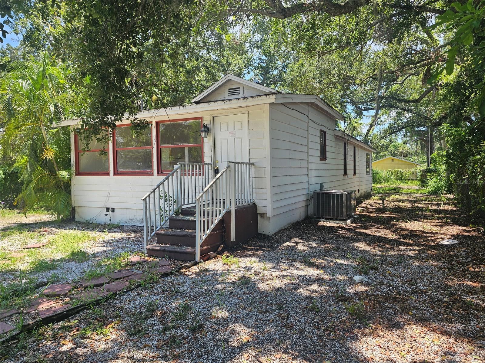 Calling all SAVVY INVESTORS. The home boasts a NEW ROOF in 2014, and NEW HVAC in 2023 but the PROPERTY is where the real value lies…at almost ¼ ACRE in the COVETED CENTRAL COCOANUT NEIGHBORHOOD (a historic district known for its charming, vintage homes and vibrant community atmosphere) there’s plenty of room for a 650sf ADU/RENTAL/GRANNY FLAT and being zoned RMF2 (Residential, Multi-Family) a duplex MAY even be possible. Opportunity is knocking…literally. Located in ‘OPPORTUNITY ZONE 2,’ where investors can take advantage of PREFERENTIAL TAX TREATMENT and SPECIAL COMMUNITY LENDING—see Revenue Codes 1400Z-1 & 1400Z-2 and the City of Sarasota website for details. This 3 bedroom 1 bath home can be a real money maker. The ‘how’ is up to you. Option 1) A RENTAL—as it was for the last 6+ years (as recently as April 2025), it’s a CASH COW. Sarasota Housing Authority Section 8 pays up to $2266/month for 3-bedroom homes in this zip code. Option 2) A REHAB PROJECT—a little TLC would go a long way while still qualifying as ‘AFFORDABLE HOUSING’ on the back end, even with a tidy profit built in. Option 3) BUILD NEW—be one of the many brand-new homes popping up in the area, then sell it or rent it out and reap the rewards for years to come. Best of all, this property offers LOW TAXES, is NOT IN A FLOOD ZONE, is located in evacuation zone D, and sustained NO FLOOD OR STORM DAMAGE. If you’re looking for a GREAT DEAL on a GREAT HOUSE, then this is the one! HURRY over & get ready to MAKE AN OFFER before it’s gone. This MOTIVATED SELLER is READY to close.