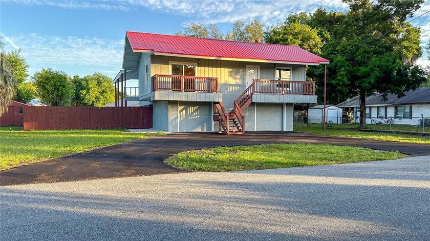 Welcome to 1118 CR 440 in Lake Panasoffkee, a rare find offering 5 bedrooms, 3.5 bathrooms,
and over 2,600 sq. ft. of living space perfect for large families, multigenerational living, or
those who love to entertain.
This two-story home features a bright and open second floor with a large living room, four
bedrooms, and two full bathrooms. The master suite includes its own private side porch accessed
via a sliding glass door, ideal for peaceful mornings or quiet evenings. A front balcony adds
charming curb appeal and extra space to relax.
Downstairs, the first floor offers flexible living arrangements with an apartment-style layout
featuring a private bedroom, living room, bonus room, kitchenette, and full bathroom—perfect as
a second master suite, guest quarters, or in-law suite. This space also has direct access to the pool
area, creating an effortless indoor-outdoor lifestyle.
The home sits on a .39-acre lot, with two garage bays for parking and additional storage.
Laundry hookups are located in the garage for convenience.
Located just minutes from Lake Panasoffkee, this home includes deeded access to a private
community boat ramp for a low $2/month HOA fee, making it ideal for boating and fishing
enthusiasts. With easy access to I-75 and close proximity to The Villages, you’ll enjoy a peaceful
lifestyle with city conveniences nearby.
Spacious, versatile, and full of potential this is the Lake Panasoffkee home you’ve been waiting