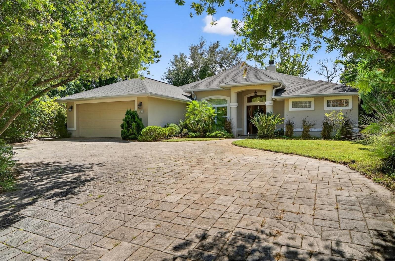 Your modern-day castle awaits in this beautifully maintained block-built home just 15 minutes from the beach, located in Palm Coast’s desirable “L” Section with top-rated schools. Packed with upgrades and energy-saving features, this move-in-ready residence boasts a fully paid-off solar system with 42 panels and battery backup (2022, $60K value), dramatically reducing summer electric bills. Inside, enjoy a split floor plan, high ceilings with tray accents, a grand primary suite with a sitting area and spa-like bath featuring a Jacuzzi tub, a stunning wood-burning fireplace, and double-pane windows with integral blinds and plantation shutters. The Google Nest thermostat and water softening system add comfort and efficiency, while the well irrigation system keeps your lawn lush and costs low. Outside, relax or entertain in the expansive lanai with a retractable awning, fenced-in yard, and high-end pergola perfect for a hot tub. A detached, powered studio offers flexible space for an office or guest suite. Some furnishings may be negotiable; artwork, outdoor fountains, TVs, and washer/dryer do not convey. This energy-smart, beach-close gem is ready to welcome you home—schedule your private tour today!