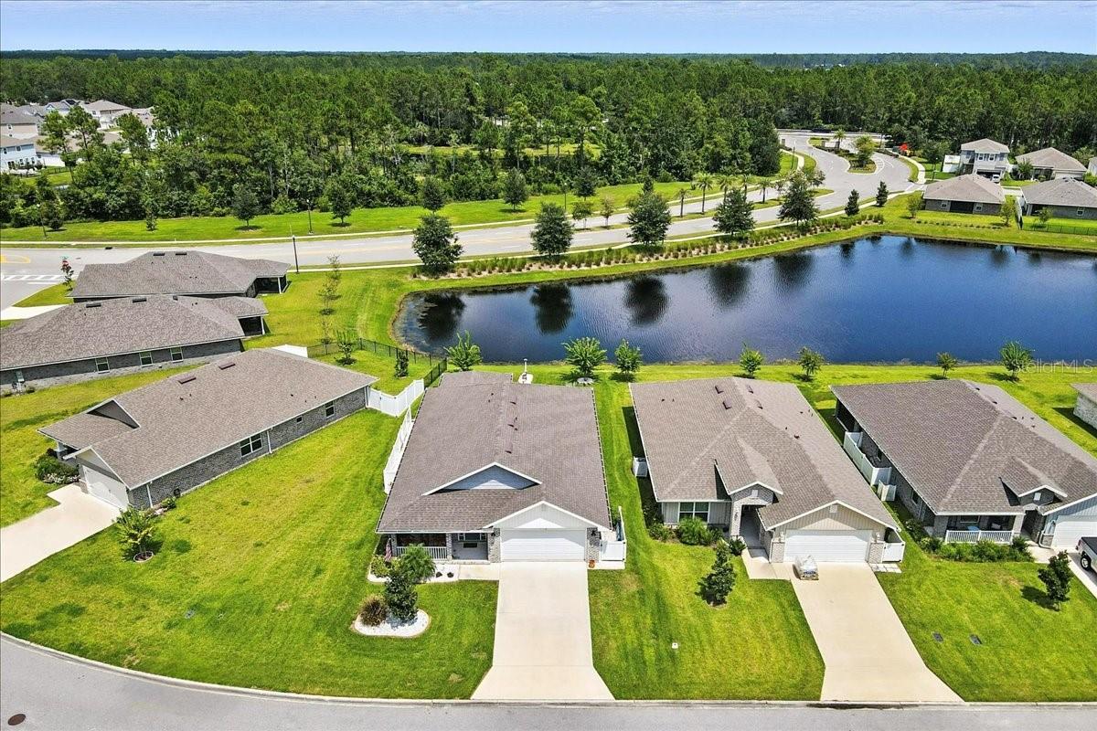 Spectacular Lakefront Home in Highly Desirable Sawmill Creek!
Imagine waking up each morning to sparkling lake views right outside your window. This stunning all-brick home is only two years old, making it feel like a brand-new build—except all the upgrades have already been done for you. From the welcoming covered front porch to the spacious screened-in lanai, every corner of this home was designed to enjoy Florida living at its best.
Inside, the thoughtful floor plan features beautiful tile floors, cozy carpet in the bedrooms, and bright open living spaces. The designer kitchen is a true showstopper with upgraded cabinetry, a full GE Profile appliance package, and a gas cooktop with convection oven. California Closet systems, plantation shutters, and custom finishes throughout make this home stylish, functional, and completely move-in ready. With more than $45,000 in enhancements already in place, there’s nothing left to do but move in and enjoy.
Outside, the upgrades continue with custom fencing, lush mature landscaping, and a garage that’s every man’s dream—featuring upgraded flooring, built-in shelving, and plenty of room for cars, toys, and more.
Life in Sawmill Creek is just as special as the home itself. The neighborhood is surrounded by new construction and is one of the most desirable communities in Flagler County. Just a short stroll brings you to the pool and mailbox center, where neighbors gather and friendships grow. Even better, you’re only 15 minutes from the sand and surf of Flagler Beach and conveniently located for an easy commute to both St. Augustine and Daytona Beach.
This isn’t just a house—it’s a lifestyle. A like-new home with all the upgrades, spectacular lakefront views, and an unbeatable location in one of the area’s most sought-after communities.
