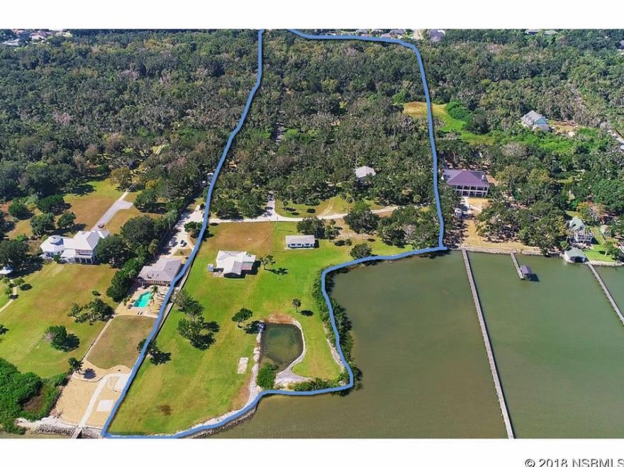 There is a place that still exists where the Oak Trees canopy the LONG private drive onto the land almost forgotten situated on. approximately 18+ acres of DEEP...VERY DEEP.....DIRECT INTRACOASTAL WATERWAY paradise with endless views of the horizon. Never look to the East at homes, just nature. Protected by 8 acres to the west from prying eyes and nosey neighbors.  Tucked away from the hustle and bustle yet minutes to grocery, shopping, and restaurants.  Surrounded by trees, nature, Existing residential dwellings consist of one building with 3 efficiencies,  there is an approximate 2,000 s.f commercial building that was used as a restaurant and a homestead that is approximately 2800 sq ft.  There is approx 330 ft DIRECTLY ON DEEP DEEP ICW water!  This was the home of the Packwood's Oyster House.  There is a building with 3 efficiencies and an old restaurant; they are not habitable at this time.  All measurements are estimated.  Property can be annexed into the City of Edgewater very easily.  Property can be subdivided off also.  At this time, the Seller wishes to keep the homestead property but may reconsider. Please call your Lifestyle Expert in the NSB Board of REALTORS for more information to discover how you can own a piece of Florida History  PROPERTY HAS A COMMERCIAL MARINA ZONING B7 AS WELL.  ASK ABOUT THE COMMERCIAL INFORMATION ;Water: City