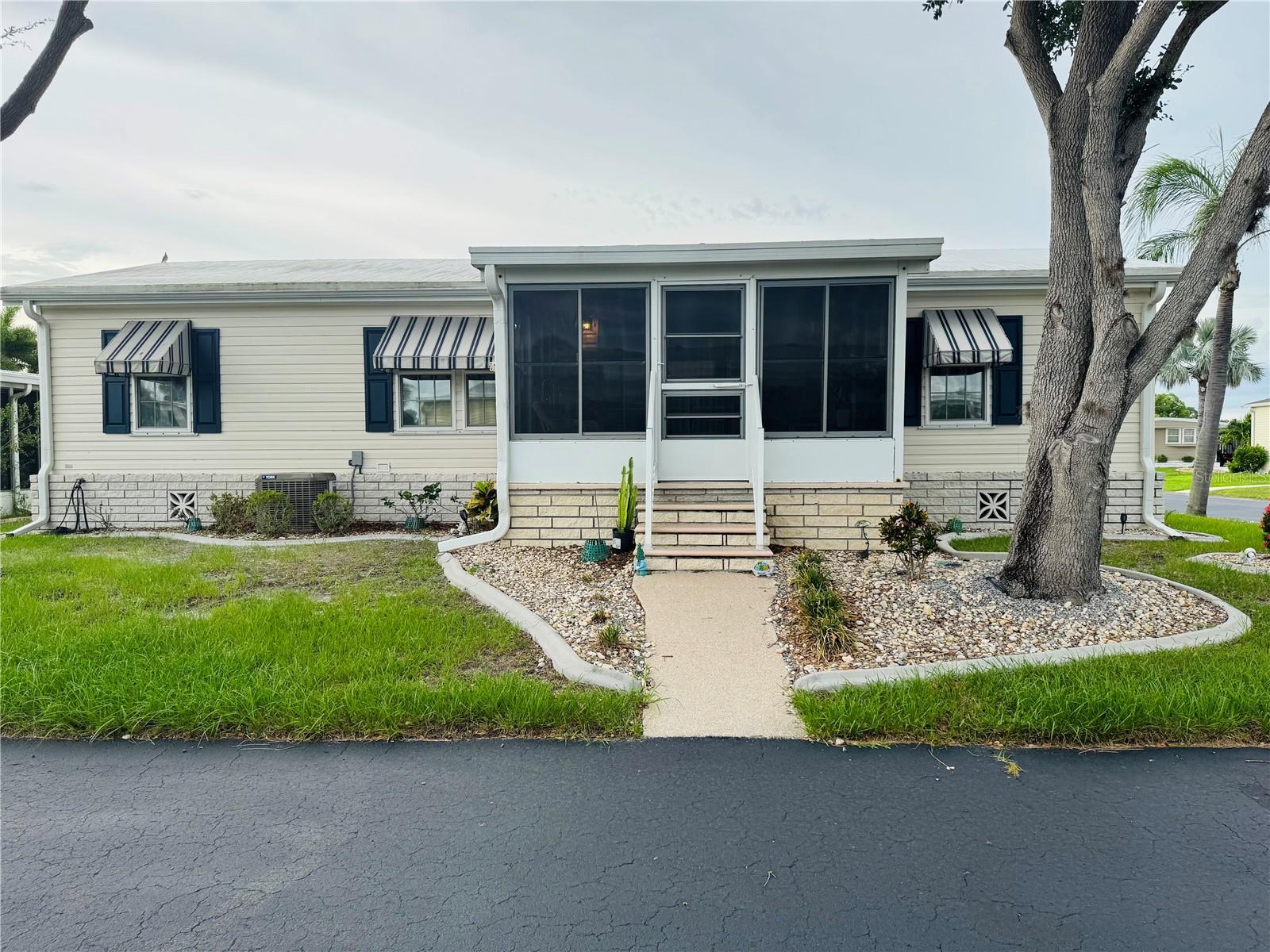Your Slice of Paradise Awaits in Port Charlotte Villages!?Picture yourself living in this breathtaking 3-bedroom, 2-bathroom haven, tucked away in a peaceful community of fewer than 500 homes—where neighbors feel like family and tranquility is a way of life. Built in 2005 and flawlessly remodeled, this corner-lot beauty is the perfect blend of modern style and cozy comfort.
Step inside and fall in love with the sleek, water-resistant laminate flooring that flows throughout the open-concept living space, bathed in natural light thanks to soaring cathedral ceilings. The heart of the home—a gourmet kitchen—shines with brand-new granite countertops and stainless steel appliances, while the spa-inspired bathrooms offer a touch of everyday luxury. Moving in? It’s a breeze with a stackable washer/dryer and partial furnishings included, plus a well-maintained golf cart to zip around the neighborhood in style.
Imagine sipping your morning coffee on the enclosed front porch lanai, soaking in serene water views, or enjoying the gentle Florida breeze through the newly installed windows of the attached 2-car carport. With a brand-new AC, advanced surge protection, and updated electrical systems, this home is as worry-free as it is stunning.
Don’t just dream about your perfect home—make it yours! Schedule a private tour today and discover why this Port Charlotte Villages gem is the one you’ve been waiting for.