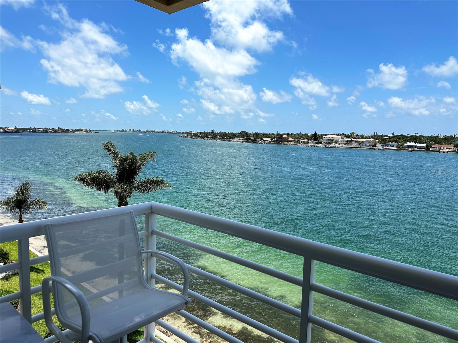 AVAILABLE AUGUST 1, 2025. THIS WILL BE AN UNFURNISHED ANNUAL RENTAL
Spectacular Waterfront Views of Pass A Grille Channel Galore from this beautifully renovated 2BR 2BA corner unit CONDO rental at Bahia Vista. 5th Floor with elevator access. Pictures currently show furniture, but IT HAS NOW BEEN REMOVED. All one level inside unit. Enjoy the beautiful sunsets, boaters and dolphins while relaxing on the outdoor balcony. Large kitchen with stainless appliances, quartz counters, beverage cooler and peninsula with seating great for hanging out with the cook! Gorgeous LVP wood flooring throughout every room. Doors, hardware, lighting all updated! Automatic shades on remote in living area along with all ceiling fans on remote. Primary Bedroom fits king size furniture with spectacular waterfront views and updated en suite bathroom with step in shower. Full size washer-dryer in utility room in the unit. Additional extra storage closet inside the unit great for bike, golf clubs, suitcases, etc. Trane central H&A. Lovely clubhouse with fitness center, heated pool & spa for your use. One assigned outdoor parking space + guest parking. Water/sewer/garbage/extended cable, WI FI and Internet included in the rent. Tenant pays electric. Sorry, NO PETS allowed per condo association at Bahia Vista.
