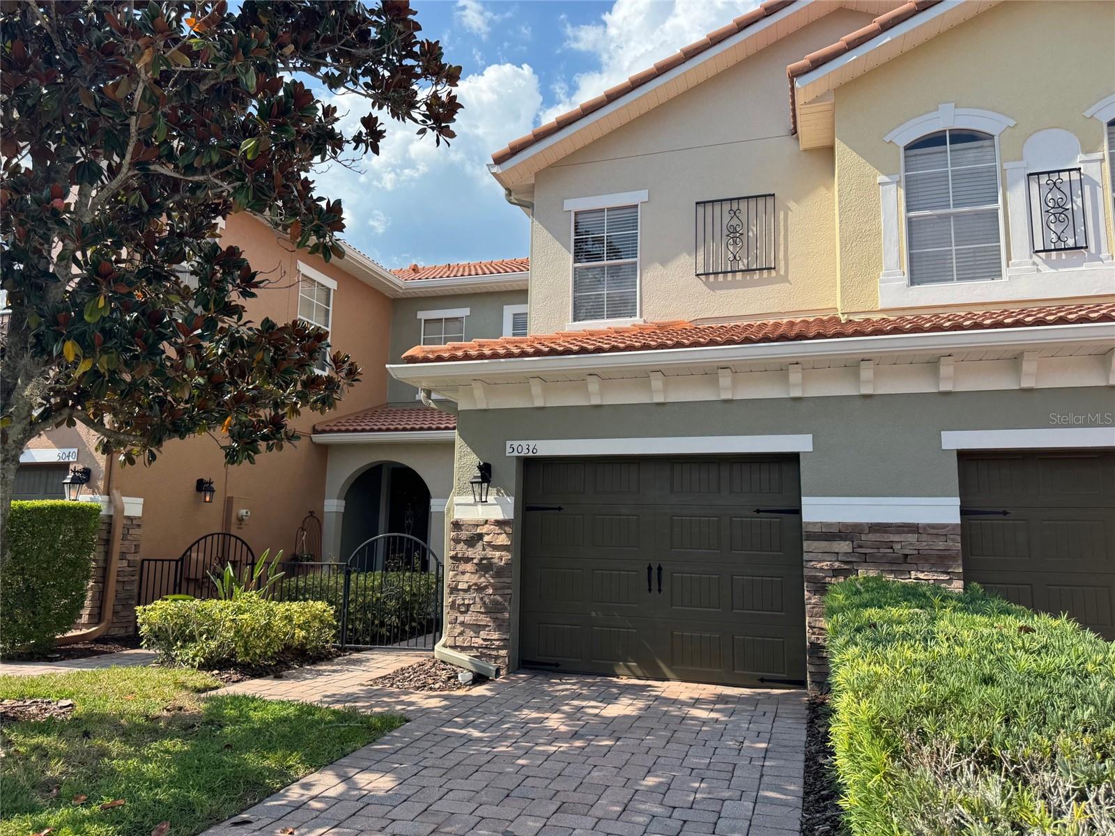One or more photo(s) has been virtually staged. One or more photo(s) has been virtually staged. Welcome to this thoughtfully updated and beautifully designed model home located in the highly coveted, gated community of Terracina at Lake Forest! As one of only four model units in this 200+ home community, this townhome features premium upgrades and a neutral, move-in-ready interior that perfectly blends style and functionality. Step inside to an open floor concept with oversized diagonal tile flooring throughout the first floor, creating a bright and spacious feel. The chef-inspired kitchen boasts pendant lighting, granite countertops, new stainless steel refrigerator, oversized cabinetry in a neutral finish, and a bar area perfect for casual dining or entertaining. A bonus flex room near the entry offers endless possibilities such as a home office, kid's homework station, cozy reading space, or extra dining area. Upstairs, the primary suite impresses with a recessed ceiling, plush carpeting, jacuzzi garden tub, dual vanities, and a tastefully tiled en-suite bathroom. Two additional bedrooms offer new plush carpeting, fresh neutral paint, and plenty of natural light. Enjoy thoughtful updates throughout, including new appliances (stainless steel refrigerator, washer, and dryer), new paint throughout, new fans with remotes, new wide-panel wood blinds, a freshly painted patio area, updated smoke detectors, and fire extinguishers for peace of mind. Residents of Terracina enjoy resort-style amenities, including a large pool with ample patio seating and a clubhouse designed for entertaining, perfect for hosting large gatherings and home to weekly poker nights. A fitness area is also available for convenience. Parking is never an issue with a private garage, driveway, nearby guest spaces, and plenty of street parking. This model home combines luxury upgrades and modern updates in one of Sanford's most desirable locations, making it an exceptional find.