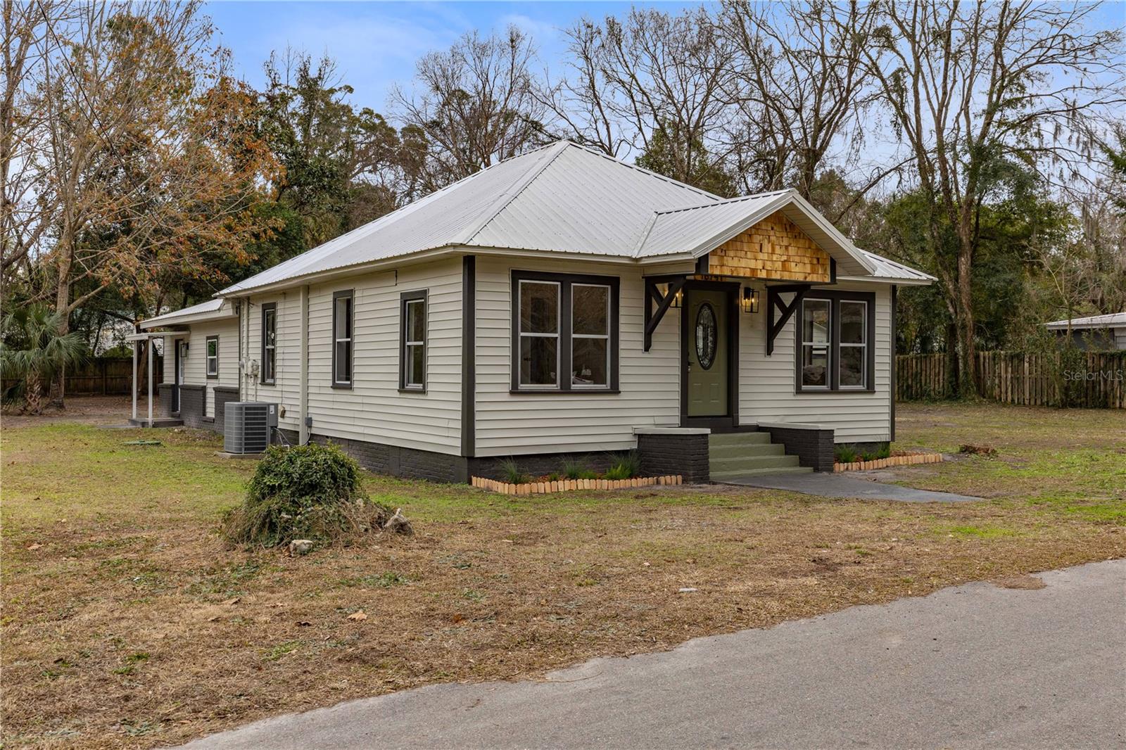 Under contract-accepting backup offers. Charming 3BR/2BA home in High Springs with brand new 2024 HVAC and durable metal roof! Enjoy a fully renovated kitchen and updated bathrooms, plus beautifully refinished hardwood floors throughout. The property features a detached storage building and a separate private entrance to a versatile in-law suite with its own bed and bath—ideal for guests or rental potential. Move-in ready and packed with upgrades, this home blends comfort and convenience just minutes from downtown High Springs. Don’t miss it!