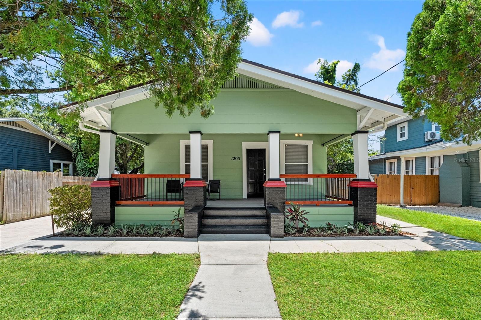 Discover 1205 E 33rd, a beautifully maintained vintage 1920 bungalow in the vibrant Seminole Heights / Ybor Heights neighborhood of Tampa. This charming 2-bedroom, 2-bath home offers a character-filled, move-in-ready space on a quiet, sidewalk-lined street just minutes from Downtown Tampa, Armature Works, Riverwalk, and more.
This home seamlessly blends timeless charm with modern updates. Highlights include a brand-new porch with dual fans, tongue-and-groove siding, new deck, and fresh exterior paint. Natural light flows through new windows, illuminating the spacious living areas. The bathrooms have been thoughtfully renovated with new vanities, a frameless glass shower, and a luxurious soaking tub. The primary suite features an ensuite bath with dual vanities, ample space, and plenty of natural light.
Original features like the fireplace, picture railing, and built-ins add unbeatable character. The kitchen showcases quartz countertops, a stylish green backsplash, stainless steel appliances, and an off-kitchen dining area. A modern laundry closet with stackable appliances is included.
Enjoy relaxing outside on the inviting back porch. The fully fenced yard is dog-friendly, with tons of parking, a double barn door gate, and a utility shed for extra storage. The home has been extensively upgraded with a new roof, plumbing, electrical, water heater, sewer line, and floors. Plus, it comes with a Home Warranty for peace of mind.
Tours available—don’t miss your chance to own this stunning Tampa Heights charmer!