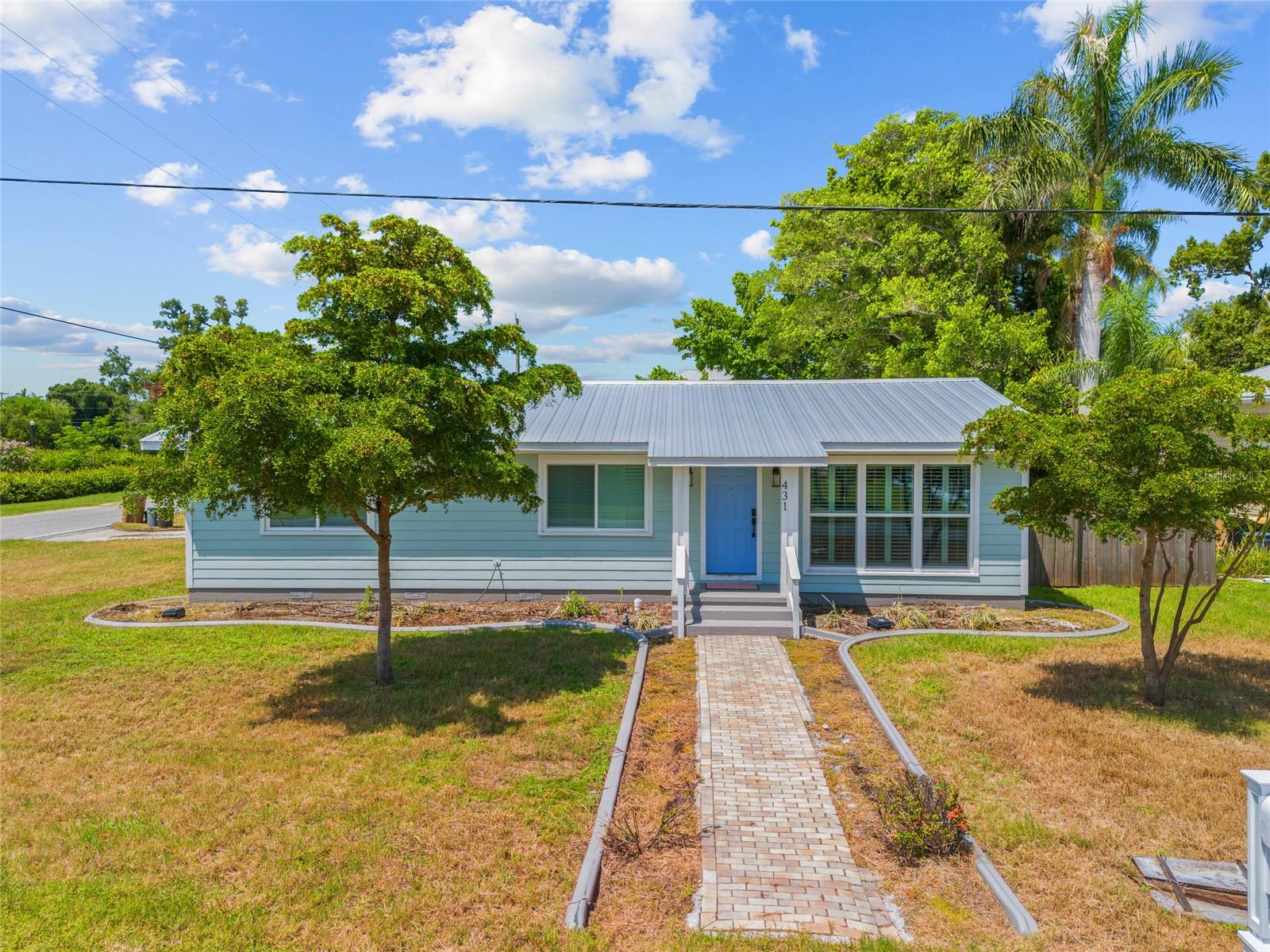 LOCATION! LOCATION! LOCATION! HEART OF DOWNTOWN PUNTA GORDA HISTORIC DISTRICT ON CORNER LOT - 4 BLOCKS FROM CHARLOTTE HARBOR! This home presents a unique chance for buyers or investors looking to restore and renovate to their vision. This charming home includes approximately 1,772 sq. ft. of living area, with 3 bedrooms, 2 baths, 2-car garage, large great room and kitchen area, granite counters, wood cabinetry, plantation shutters, covered lanai and fenced backyard. Impact windows. Brand new metal roof and siding after Ian. Electrical and plumbing are working. Unbeatable location, within walking distance to top attractions, including Fishermen's Village, The Yacht Club, Gilchrist Park, restaurants, boutique shopping, community events, and scenic biking and walking trails. Whether you’re envisioning a personal retreat or an investment property, the potential is endless in this prime location. Priced to reflect its condition, this home provides a rare opportunity to create equity in a sought-after area and being sold "as-is" due to flood damage.