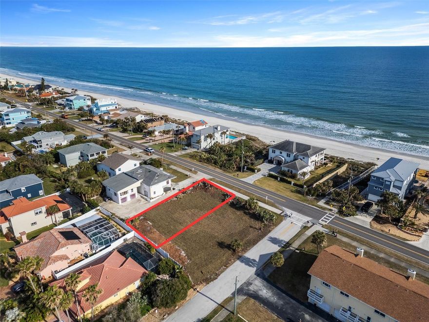Perched on one of the highest points in Ponce Inlet, outside the flood zone, this rare vacant lot offers an unparalleled opportunity to build the coastal retreat you’ve always envisioned. With zoning allowing a 35-foot-wide building footprint and a towering 35-foot height, your dream home can rise above it all, capturing unobstructed ocean views from the second and third levels—and even a rooftop terrace if you desire. ///
 
Your days will begin with the sun cresting over the Atlantic and end with the sky ablaze in color as the sun sets over the Halifax River. A crosswalk to the beach boardwalk places your toes in the sand within moments, ensuring that every sunrise walk and moonlit stroll is effortless. ///
 
This is more than a piece of land—it’s the canvas for your vision, the foundation of a lifestyle defined by expansive beauty, boundless views, and the endless rhythm of the sea. Close your eyes for a moment. Imagine waking up to the sound of the waves, the golden light of dawn spilling over the horizon. Step onto your future balcony where an uninterrupted expanse of ocean stretches before you. Breathe in the salty air. This is home.
