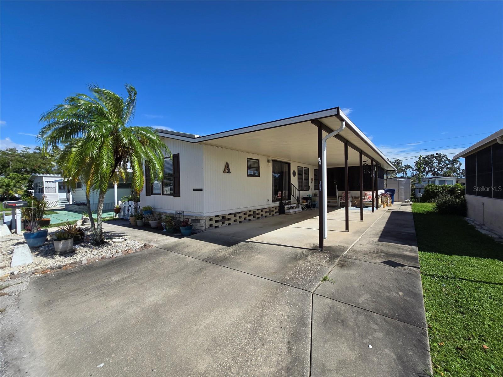 Welcome to this well-maintained manufactured home in the desirable, non-age-restricted community of PIC Town in Bradenton. This home has been thoughtfully updated with new piping throughout, a new water heater (2024), and a lanai enclosed with hurricane-rated windows for year-round enjoyment.Inside, you’ll find vinyl flooring throughout for easy care and a clean, modern look. The guest bedroom features custom built-in closets and dresser, providing excellent storage and a stylish touch. The home offers a comfortable split-bedroom layout with two full bathrooms, making it ideal for guests or multi-generational living. Located just off U.S. 41, you’re minutes from shopping, dining, and entertainment, and only a short drive to Sarasota’s beaches and cultural attractions and Anna Maria Island.
This home combines comfort, updates, and convenience—perfect for year-round living or a seasonal retreat!