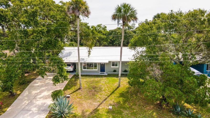 Recently remodeled beach-side 3/2 block house in a great location. Porcelain tile throughout, custom ship lap in living and dining rooms. All new electric wiring, panel and LED lighting. New a/c and duct-work throughout. New natural gas service to home with tank-less water heater, dryer, range and plumbed for outdoor kitchen. Beautiful new kitchen cabinets, premium quartz counter tops, Kohler farmhouse sink and fixtures, LG black stainless (refrigerator, dishwasher, gas range) KitchenAid under counter convection microwave, under cabinet lighting and custom vent hood.  Completely remodeled guest bathroom with glass tile and weathered wood vanity.  Master bathroom has also been completely remodeled with large shower and double vanity. All new interior and exterior doors as well as fresh paint inside and out. Metal roof replaced in 2016. This lovely home overlooks a biking and jogging path across the street that runs alongside the Indian River Lagoon. South along the bike path are nature trails and a kayak launch area or go just 2 blocks over to the Beach. ;Water: City