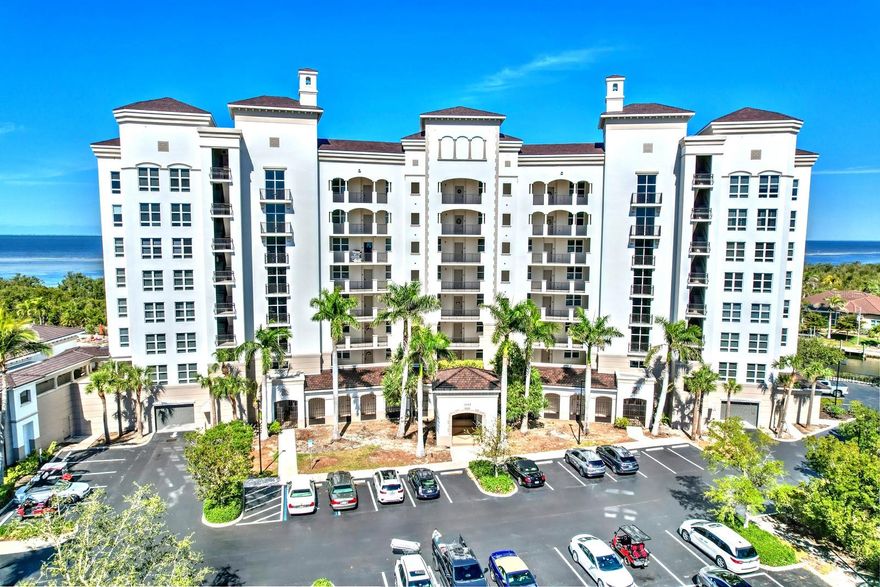 Discover luxury living in this beautiful 3 bed, 3 bath end unit located within the prestigious complex known as Grande Isles. Secure behind a second gate in Burnt Store Marina, Grande Isles offers the finest in amenities and Harbor views. This spacious 2,351sf residence features the largest floorplan in a wonderful open layout with split bedrooms – two with ensuite baths - plus a Den/Office, perfect for working from home. The living and dining areas create an inviting ambiance with long-range views of Charlotte Harbor and an interior bathed in natural light from large sliding doors and windows on three sides. With updated stylish cabinets, stainless appliances, abundant prep area on granite counters, and an expansive breakfast bar, the open kitchen is ideal for entertaining. And a separate wet bar and mini-fridge help you handle parties effortlessly! This location at the quiet end of the community features a very private lanai that overlooks a serene residential area to the north and panoramic Harbor views to the west where you’ll enjoy boating activity during the day and breathtaking sunsets over the water. Fees cover exterior insurance, cable TV and internet, water and sewer, private air-conditioned storage, a secure under-building parking space, and two AC systems maintained by the association. Residents of Grande Isles also enjoy an array of amenities, including a central clubhouse with community room and catering kitchen, fitness room, dry sauna, steam room, huge heated pool and spa, and a home theater for game day and movies! Burnt Store Marina offers the fastest access to open water in SW Florida, along with wet and dry boat storage, Freedom Boat Club, tennis, pickleball, fitness center and a public 27-hole executive golf course. Enjoy two onsite restaurants, a Ship’s Store, new dog park and miles of streets for walking. With 24/7 security and loads of activities to keep you busy this is resort-style living at its best!