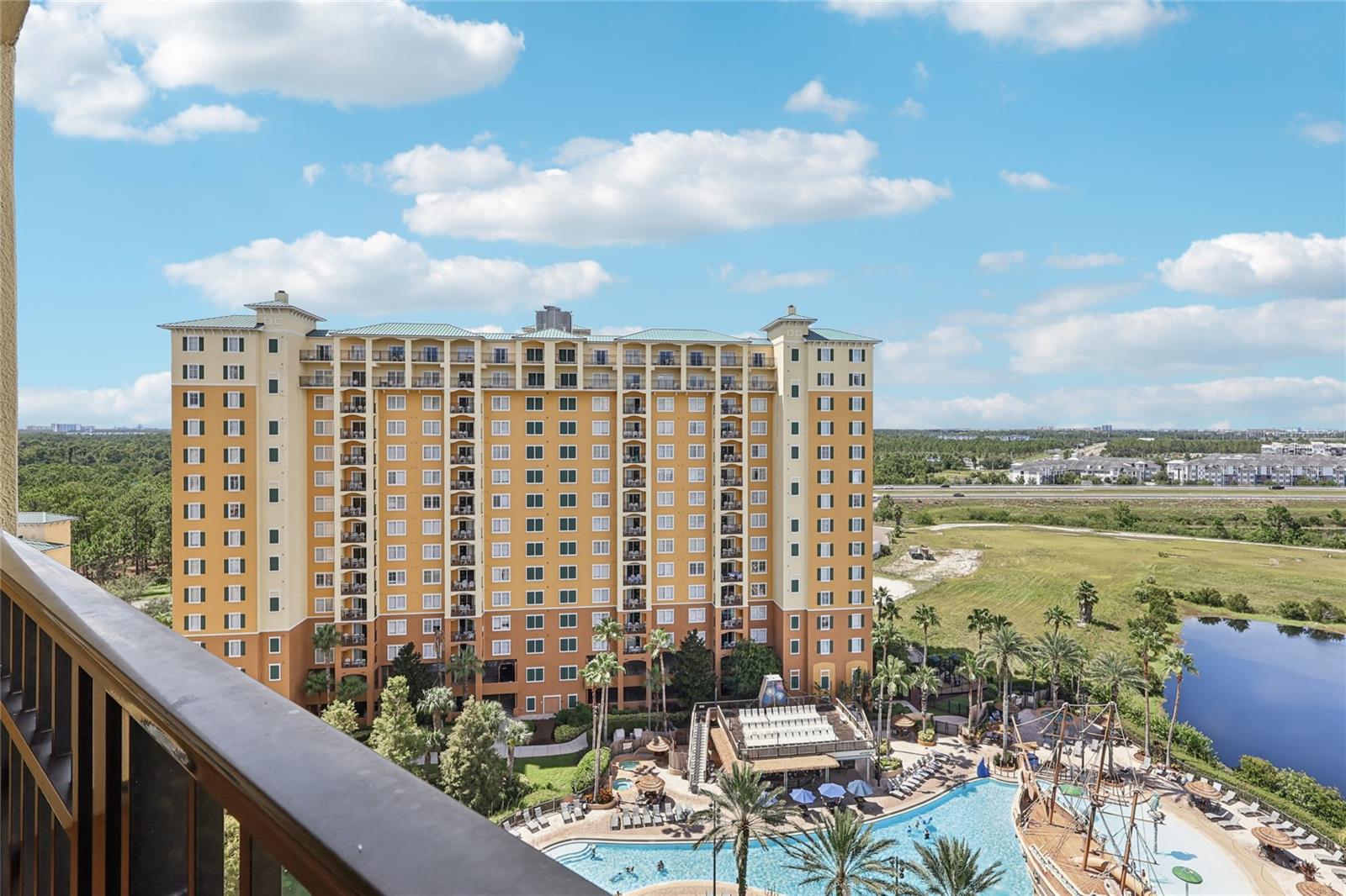 Live Above the Adventure – 12th-Floor Resort Condo with Pirate Ship Pool View! Unlock a front-row seat to fun and fantasy with this rare 12th-floor gem at the highly acclaimed Lake Buena Vista Resort and Spa! Overlooking the resort’s iconic pirate ship pool complex, this fully furnished 2-bedroom, 2-bathroom condo is more than a vacation home—it’s an experience waiting to happen. Step into a sun-drenched sanctuary where vibrant Florida charm meets sleek, resort-style comfort. From your private balcony, take in panoramic views of swaying palms, sparkling waters, and the thrilling pirate-themed water playground below—an unbeatable visual for guests and owners alike. Inside, the spacious split-bedroom layout offers ultimate privacy and convenience. The primary suite features a luxurious garden tub, dual sinks, and an oversized vanity—perfect for winding down after a day at the parks or a dip in the pool. The open-concept living and dining area is ideal for relaxing or entertaining, while the modern kitchen comes fully equipped to handle everything from morning coffee to post-theme-park feasts.
The resort offers world-class amenities including a full-service spa for the ultimate relaxation, state-of-the-art fitness center, huge game room, on-site dining, Irish pub, sundries shop and scheduled shuttle service to major theme parks. Owners and guests alike enjoy the tropical zero-entry pool with pirate ship waterslide & splash zone, additional quiet pool, hot tubs, and convenient access to the Lake Buena Vista Factory Stores just next door. This high-floor unit is not only a vacation haven but also a powerful income generator. Its prime pool-facing view, resort access, and unbeatable location just 5 miles from Walt Disney World make it one of the most desirable spots in the Orlando vacation rental market. Whether you’re a seasoned investor, a vacationer with a dream, or both, this unit checks every box for lifestyle and ROI. And here's the kicker—units with this kind of view and elevation rarely hit the market. Don't just dream it—experience it. Request a private showing today and claim your place in the heart of Orlando’s magic. Take a virtual tour now at https://www.zillow.com/view-imx/6491db05-a675-4070-9ff6-2f24ddd99f58?wl=true&setAttribution=mls&initialViewType=pano