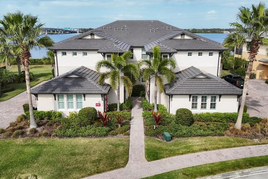 A boater’s dream come true, this first-floor carriage home is perfectly positioned directly on the Manatee River within the guard-gated waterfront community of Tidewater Preserve. Designed with an open, airy layout, the residence features neutral tile flooring and soft, coastal-inspired tones throughout, creating a light and inviting atmosphere.

A pavered driveway and side-turned two-car garage lead to a private entry and bright foyer, where refined architectural details immediately stand out. High-volume coffered ceilings, crown mouldings, chair rails, cornice boxes, decorative mouldings, lit tray ceilings, and Hunter Douglas plantation shutters add timeless elegance and craftsmanship throughout the home.

The open-concept living space seamlessly connects the dining room, kitchen, great room, and breakfast nook, all oriented to capture tranquil lanai and river views. The kitchen is both stylish and functional, featuring granite countertops, 42-inch wood cabinetry with under-cabinet lighting, stainless steel appliances, pendant lighting, and a spacious counter-height island ideal for gathering and entertaining.

The waterfront primary suite offers a serene retreat with river views, dual walk-in closets, a walk-in shower, dual vanities, and a private water closet. Two guest bedrooms are thoughtfully placed on the opposite side of the home for added privacy, complemented by a beautifully updated guest bathroom.

Step outside to the expansive screened lanai with epoxy flooring, overlooking the water and offering ample space for relaxing or entertaining. Located just moments from the marina with boat slips and lifts, this home provides quick and easy access to open water.

Tidewater Preserve delivers a resort-style lifestyle with three sparkling pools, two state-of-the-art fitness centers, tennis courts, a kayak launch, scenic waterfront nature trails, pet-friendly spaces including a dog park, a playground, and a clubhouse with billiards and a kitchen. Enjoy a vibrant social calendar featuring year-round events from boat parades to live music. Best of all, this is true maintenance-free living, with all lawn care and landscaping handled by the HOA—allowing you to fully embrace the waterfront lifestyle.
