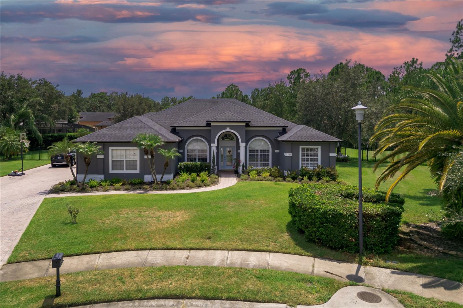 Prepare to be impressed! This exquisitely renovated masterpiece in the highly desirable Live Oak Reserve offers the perfect blend of luxury, privacy, and modern convenience. Tucked away on a quiet cul-de-sac in Oviedo, FL, this 4-bedroom + bonus room, 3-bath home sits on over half an acre, backing up to a protected conservation area—no rear neighbors, just nature and serenity.
Step inside and experience the “wow” factor—vaulted ceilings, abundant natural light, and brand-new luxury vinyl floors (2023) set the tone. The expansive layout features elegant formal living and dining rooms, a spacious family room, and a versatile bonus room perfect for an office, playroom, or guest suite.
The heart of the home is the designer kitchen, fully remodeled in 2023 with an oversized exotic Brazilian quartzite island, Samsung stainless steel appliances, built-in wine fridge, and a custom coffee/wine bar that elevates every gathering.
Retreat to the luxurious owner’s suite, a true sanctuary with a rustic divider wall and see-through electric fireplace, walk-in closet, and a show-stopping spa bathroom complete with soaking tub, double vanities, makeup station, LED mirrors, and a waterfall shower.
Step outside to your private paradise—a saltwater pool and spa (2021) with color-changing lights and jets, surrounded by lush landscaping, aluminum fencing, and unobstructed views of the natural reserve. Plus: Invisible Fence® system (2025) with dog collar included, 3-car garage, extended paver driveway, and automatic sprinkler system.
Loaded with smart home tech: control pool, spa, and A/C from your phone, plus Ring security cameras at every key entry point.
Located in a community packed with resort-style amenities—clubhouse, fitness center, pool, tennis courts, playgrounds—and zoned for A+ rated schools. Just 16 minutes to UCF, close to Oviedo on the Park, restaurants, and shopping.
This home truly has it all—luxury, location, and lifestyle. Come fall in love!